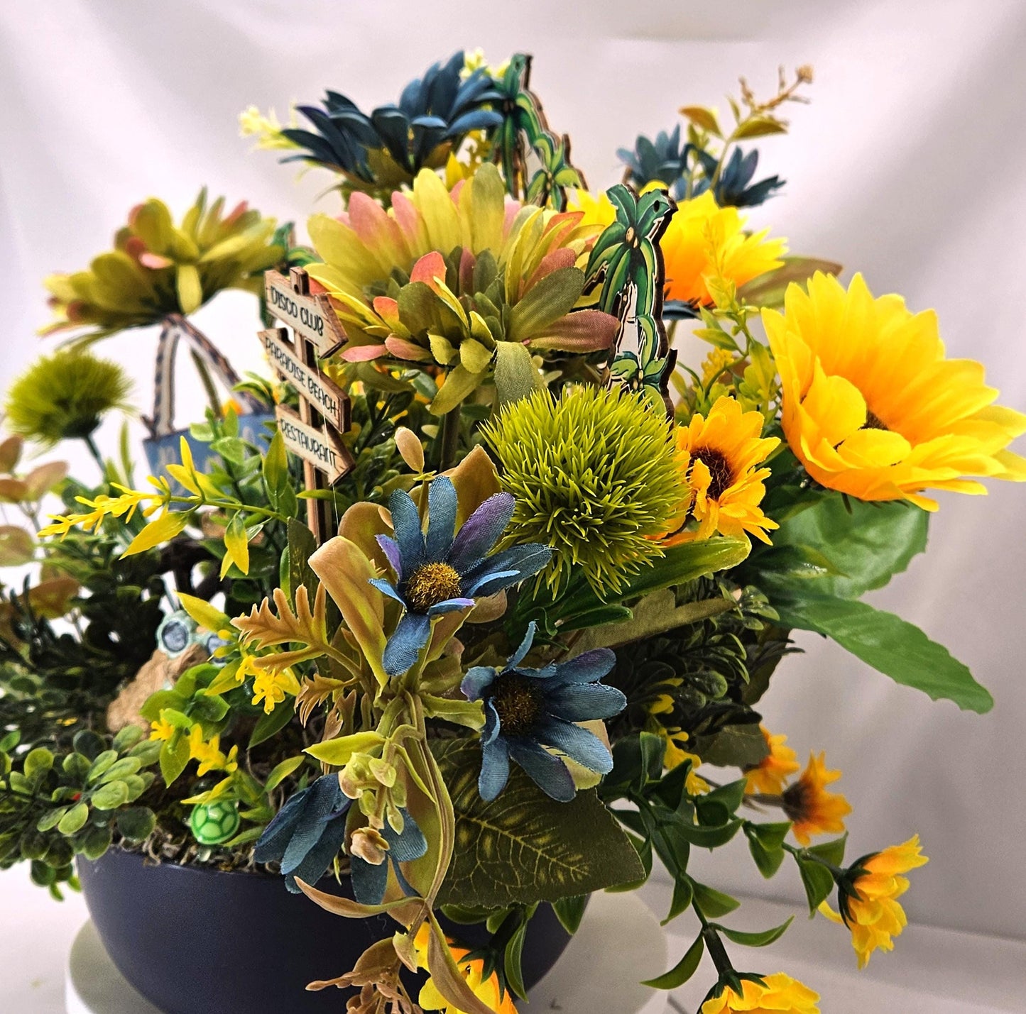 Fun in the Sun Turtle Mania Tropical Flower Arrangement/Turtle in Sunglasses in garden of Teal/Yellow/Green Flowers/Greenery/Bridge