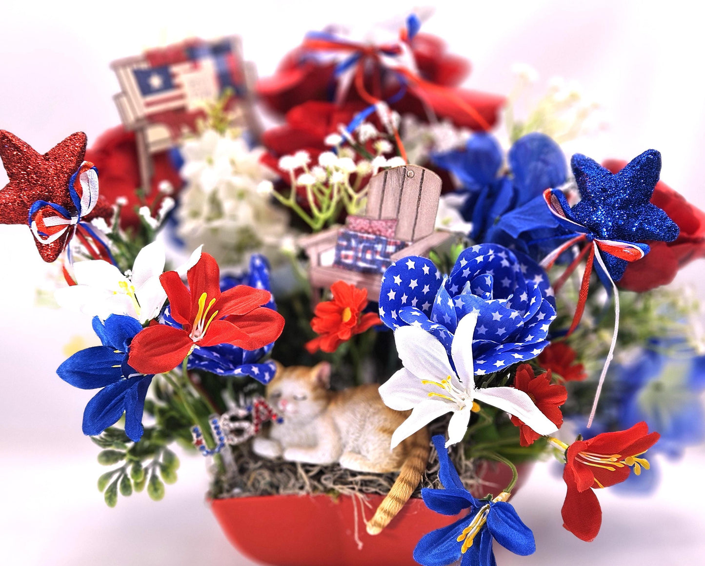 Patriotic Cat Floral Arrangement – Belly-Up Kitten or Lying Cat in Star Dish with Red White Blue Flowers