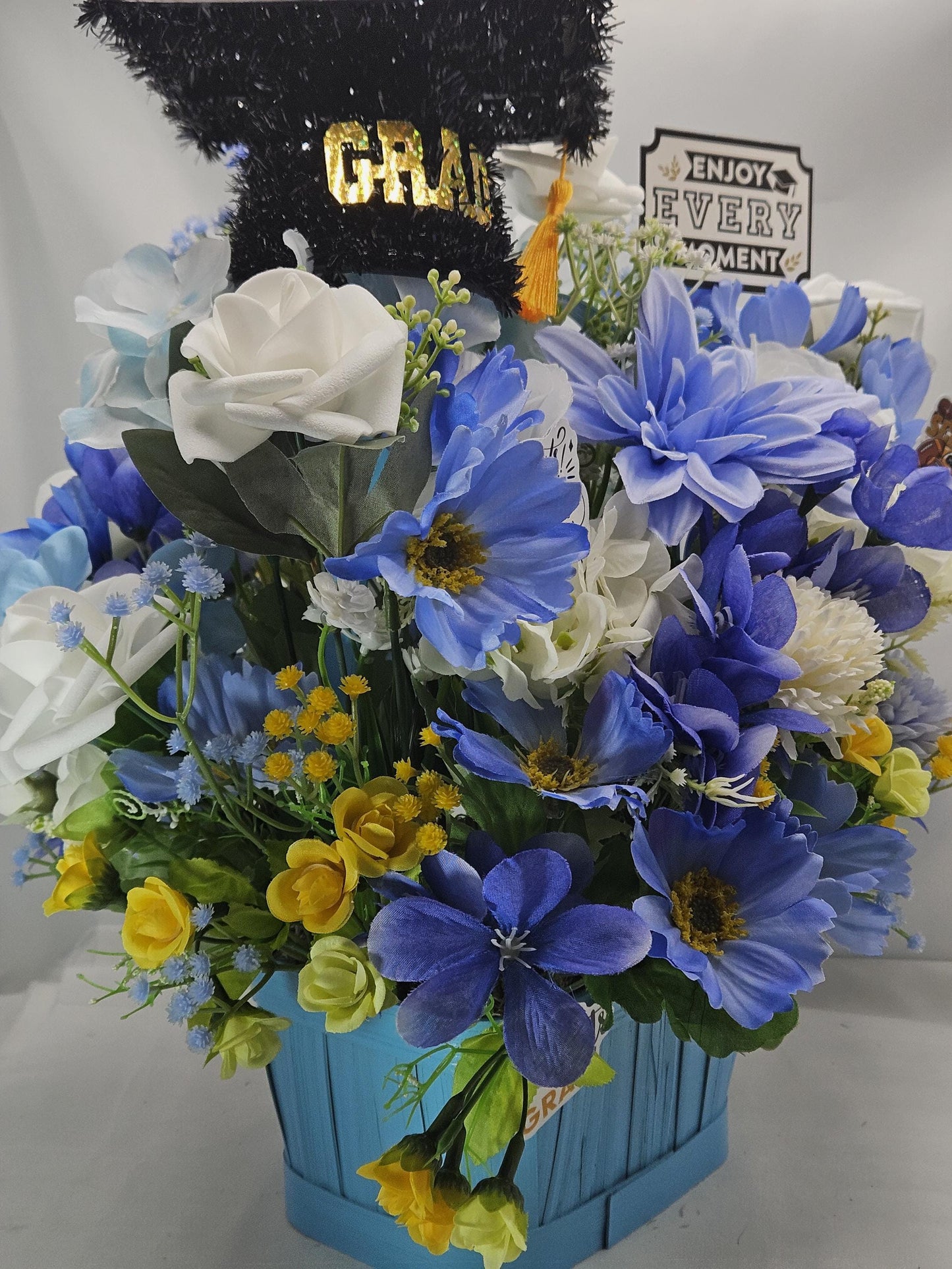 Graduation Floral Centerpiece/Blue Wood Basket/Blue/White/Yellow Flowers/Graduation Hat/Congratulations Messages/Roses/Dahlias/Pansies Plus