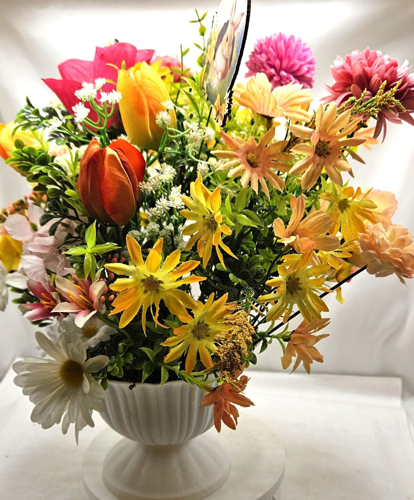 Cheery Hello Spring Floral with Cute Rabbits, Pansies, Daisies, Tulips and Other Vibrant Wildflowers in an Elegant Plastic Footed Bowl