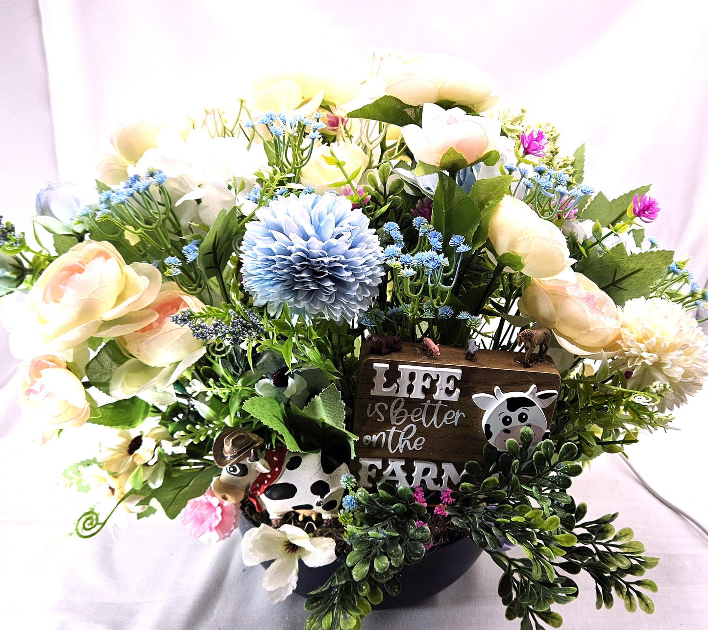 Life is Better on the Farm Floral Centerpiece w/Country Cow, Curious Sign and Various Farm Farm Animals Amidst Ranunculus/Other Flowers