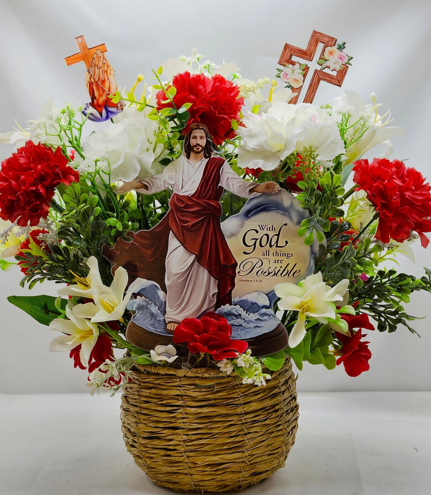 With God All Things Are Possible Flower Centerpiece Featuring Jesus Rising Within A Floral Garden of Lilies/Carnations/Added Cross Signs