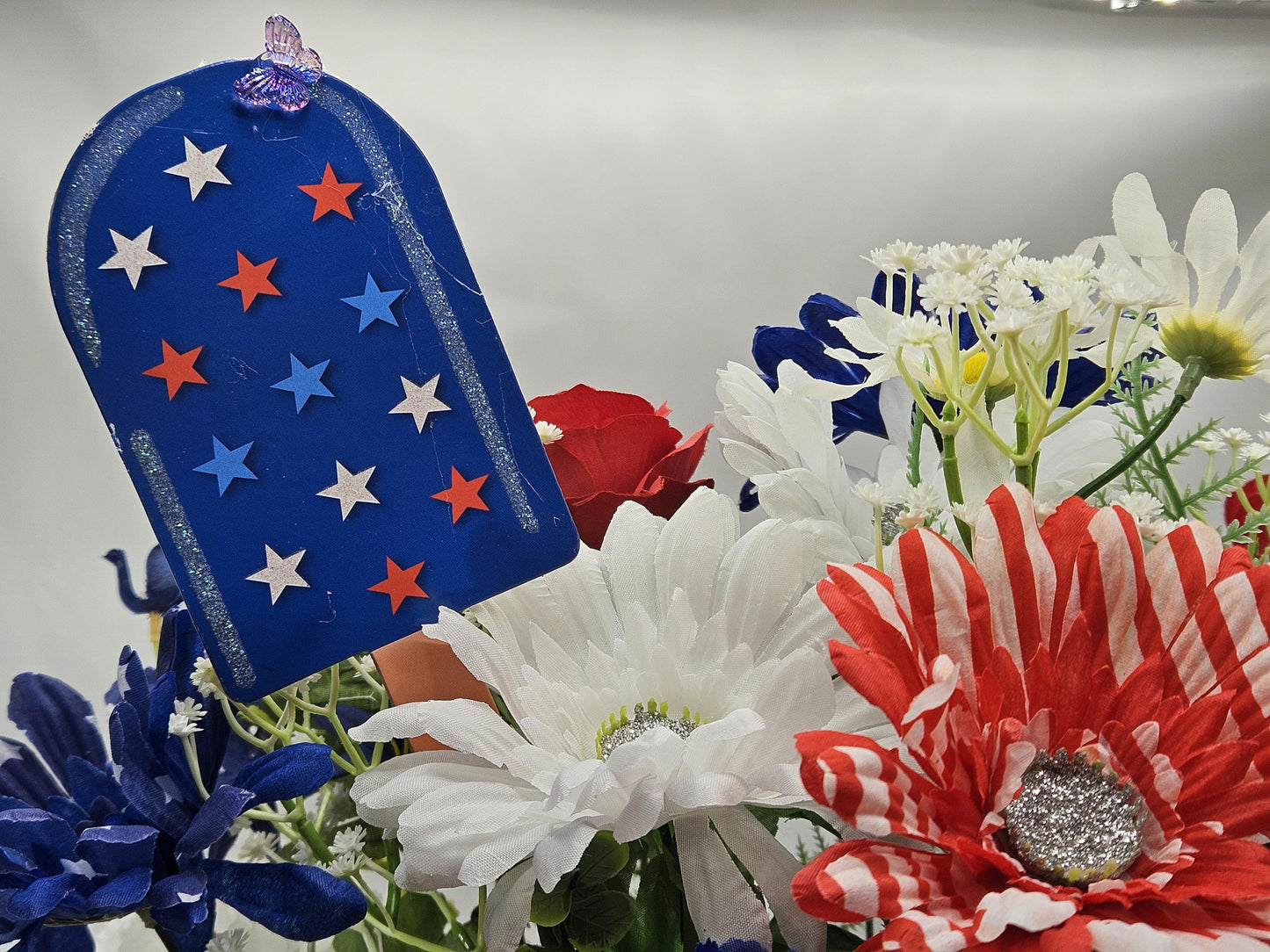 Gnome in the USA Patriotic Flower Arrangement, Oval Wicker Basket, Red White Blue Daisies, Sunflowers, Carnations