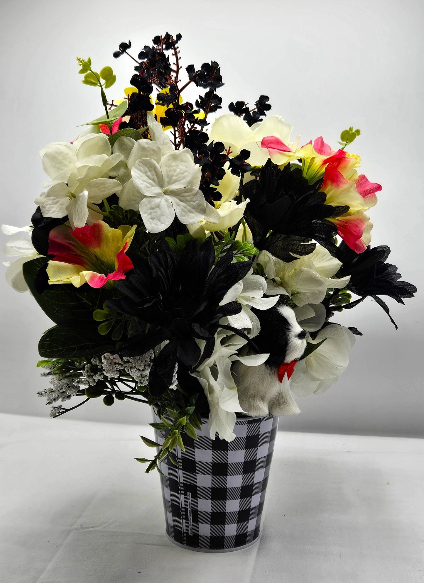 Unique Dog Enriched Black and White Floral Decor with Touch of Pink and Yellow in Black and White Checkered Pot