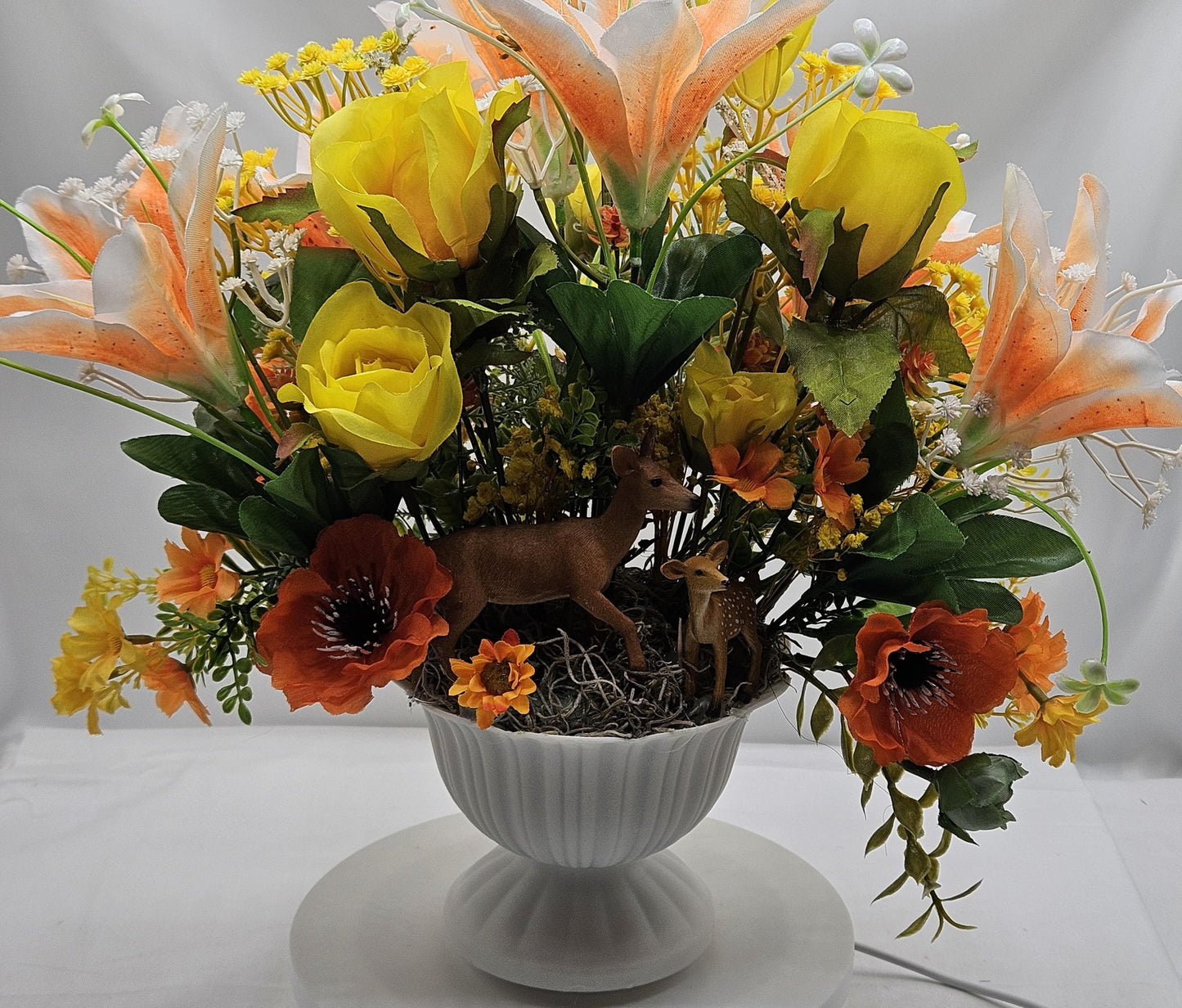 Momma and baby deer frolicking in a floral garden of yellow and orange Lilies, Pansies, Roses/other Florals, Greenery/Baby's Breath/Gifting