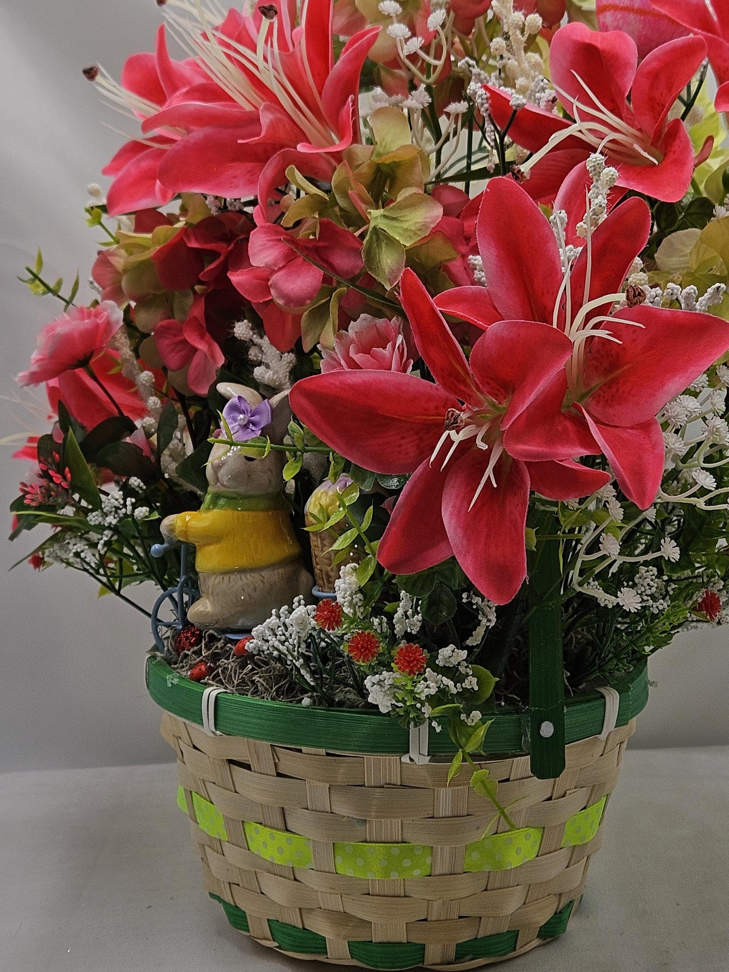 Whimsical Easter Basket/Rabbit in Bike Carrying Goodies/Accented W/cute Ladybugs/Hot Pink Lilies/Other florals/pink/green/Greens/Baby Breath