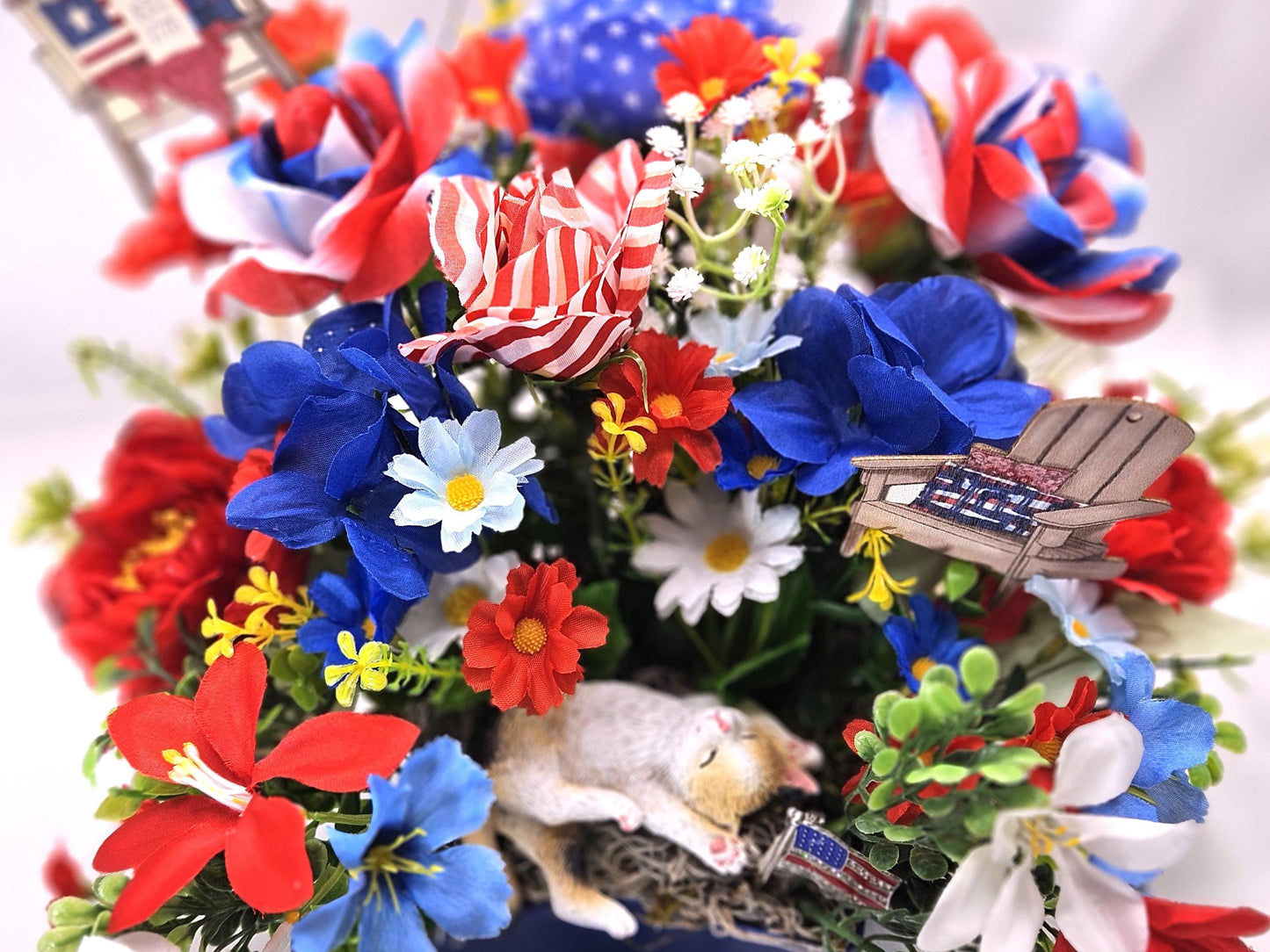 Patriotic Cat Floral Arrangement – Belly-Up Kitten or Lying Cat in Star Dish with Red White Blue Flowers