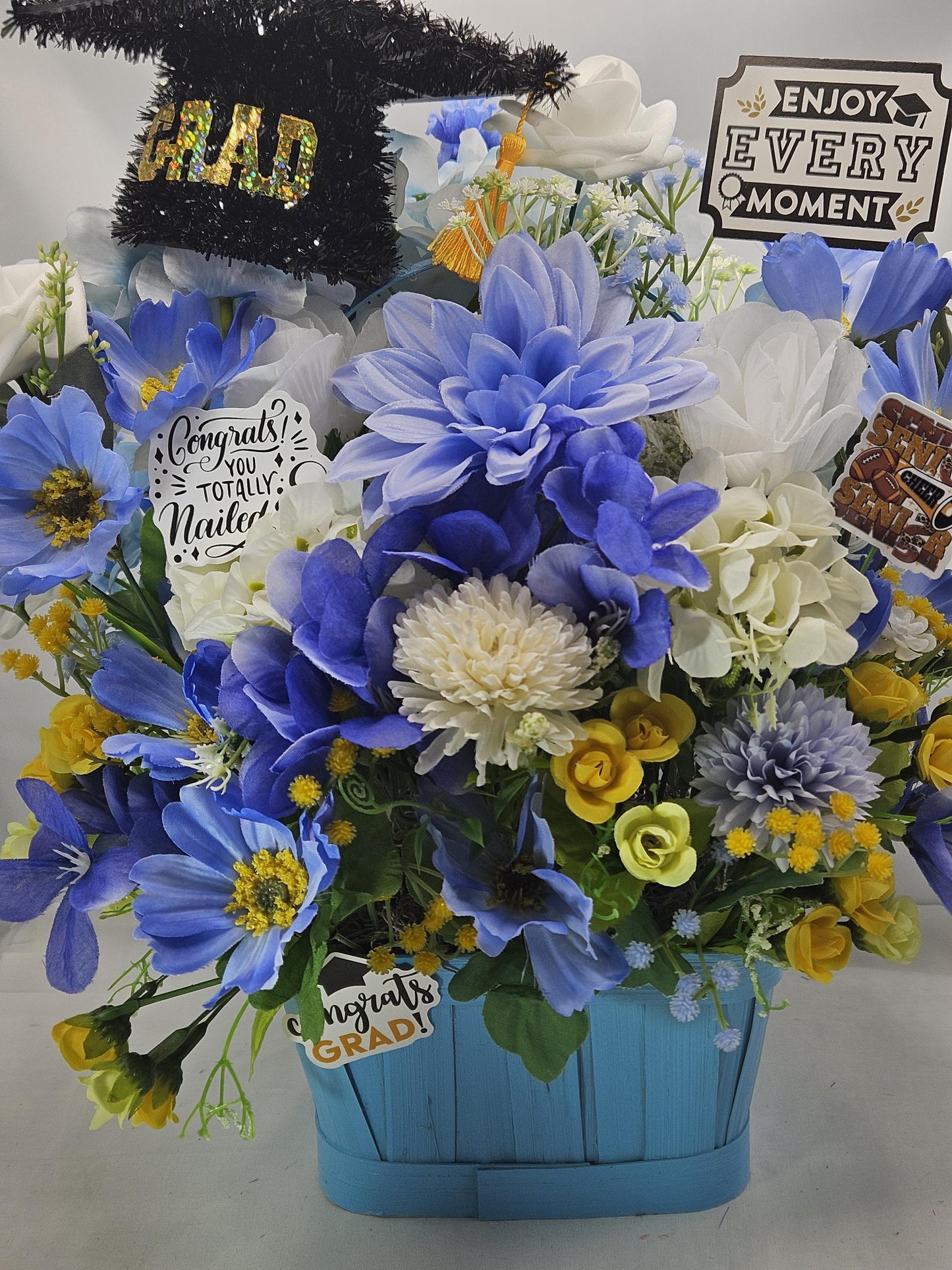 Graduation Floral Centerpiece/Blue Wood Basket/Blue/White/Yellow Flowers/Graduation Hat/Congratulations Messages/Roses/Dahlias/Pansies Plus