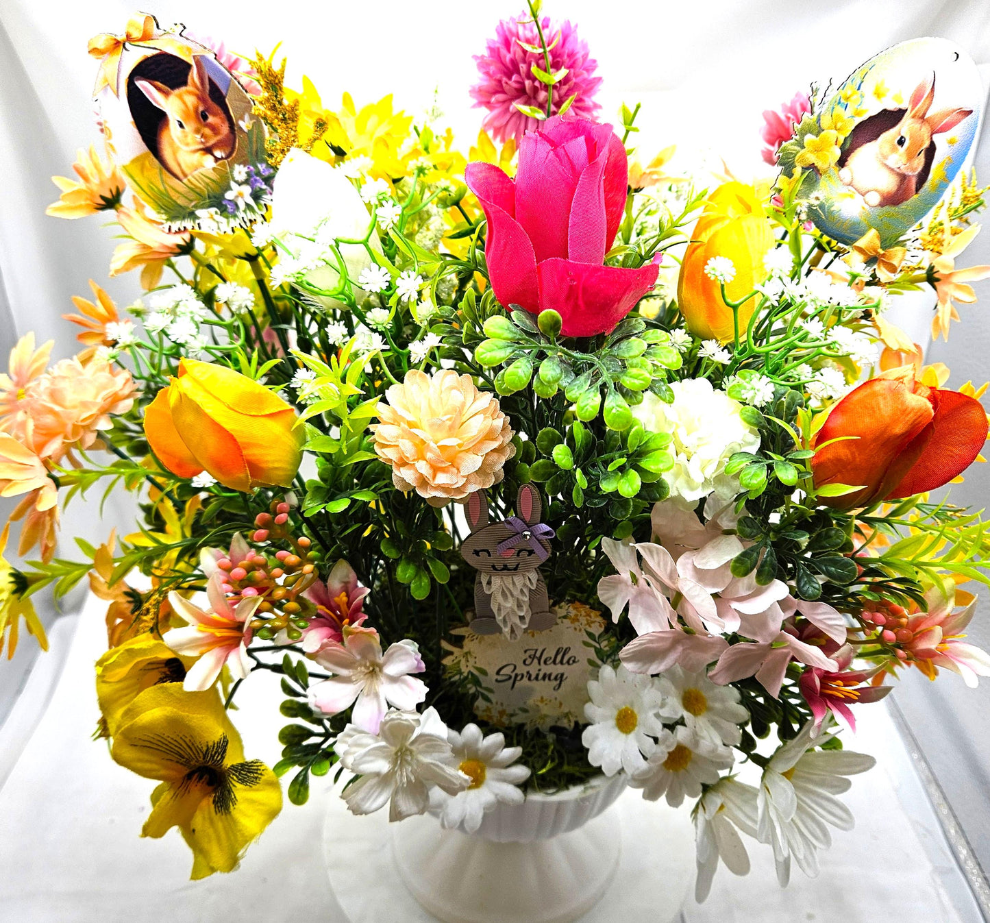 Cheery Hello Spring Floral with Cute Rabbits, Pansies, Daisies, Tulips and Other Vibrant Wildflowers in an Elegant Plastic Footed Bowl
