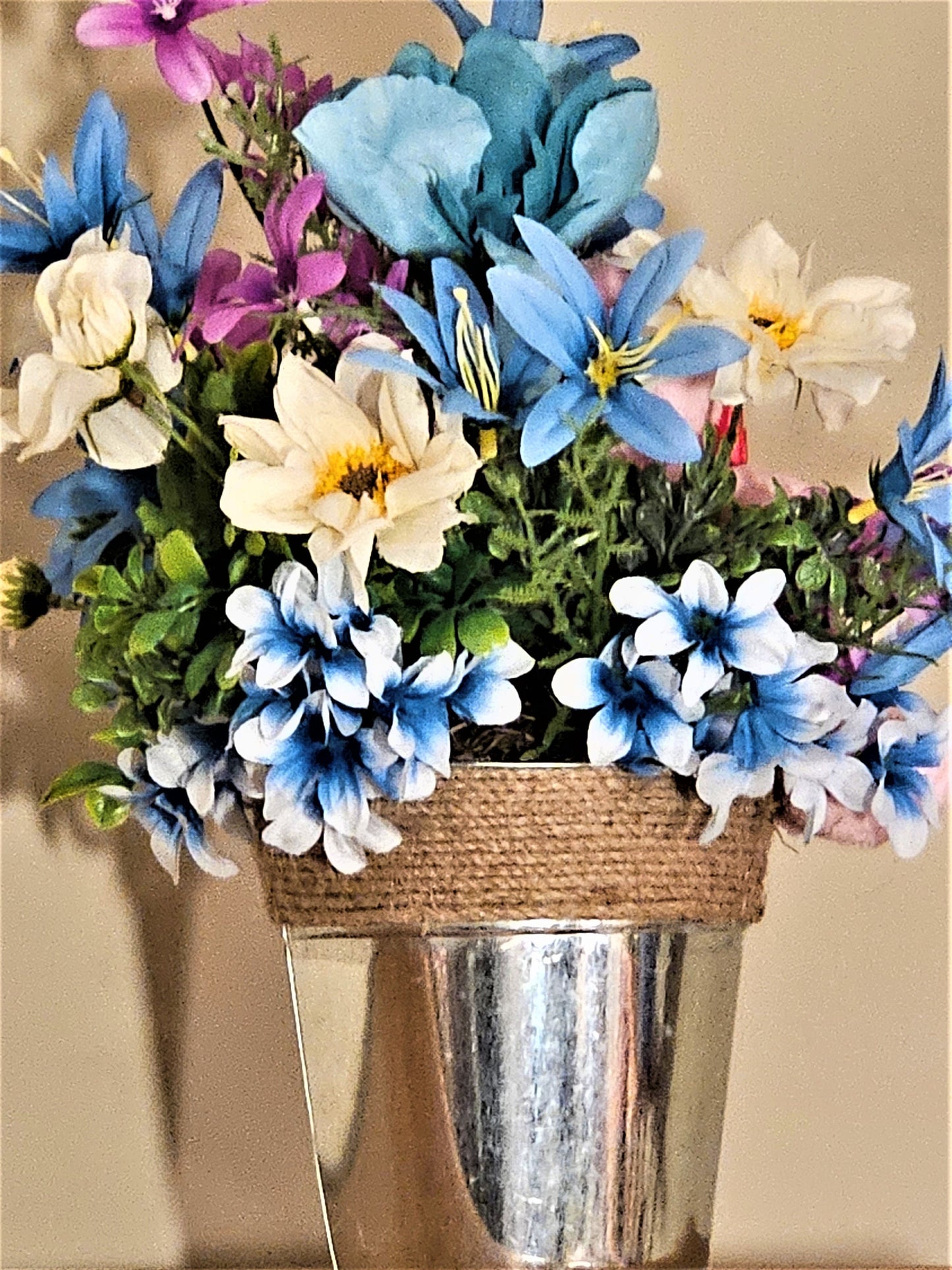 Artificial Flower Arrangement with Teddy Bear Sitting in a Bucket