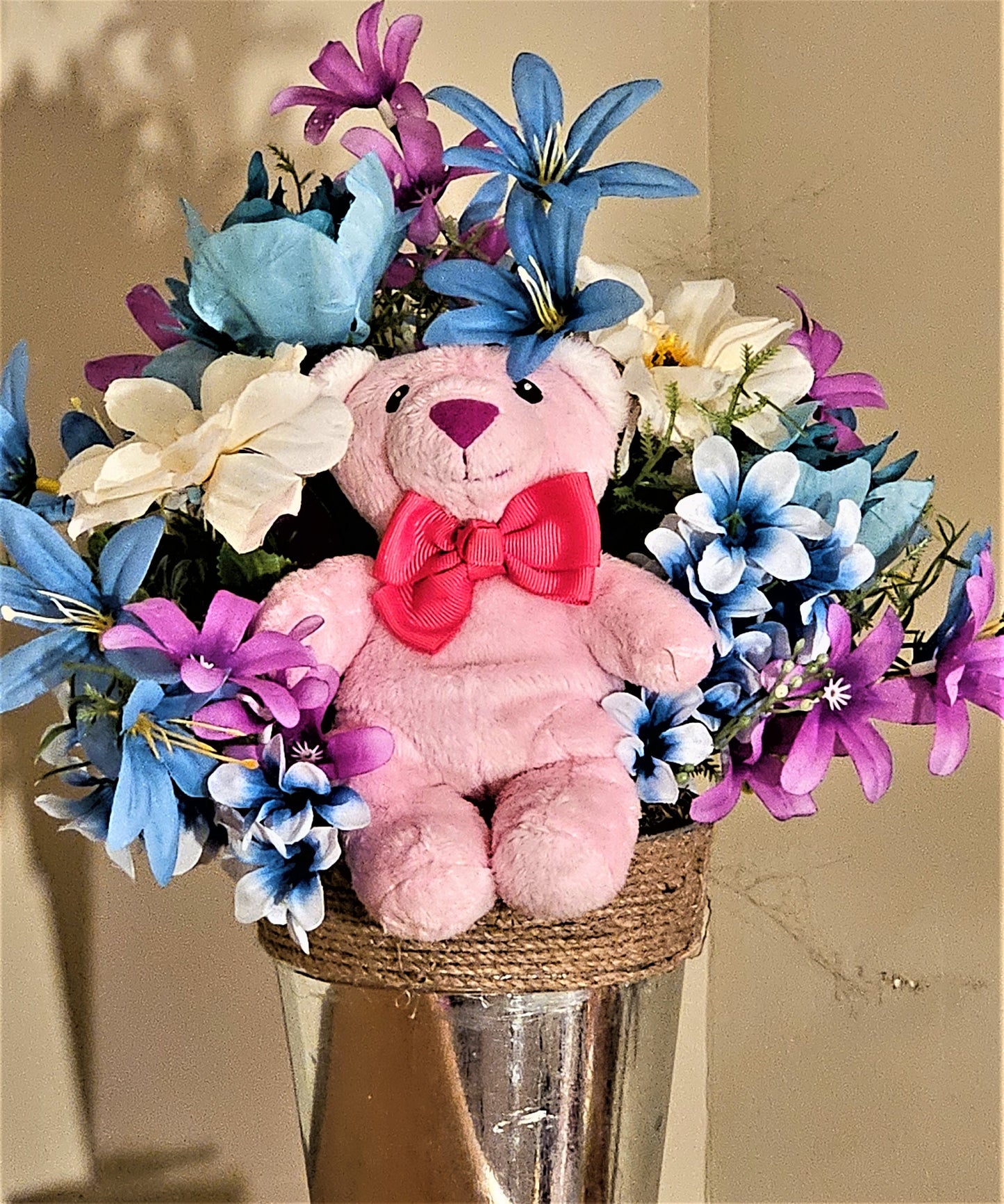 Artificial Flower Arrangement with Teddy Bear Sitting in a Bucket