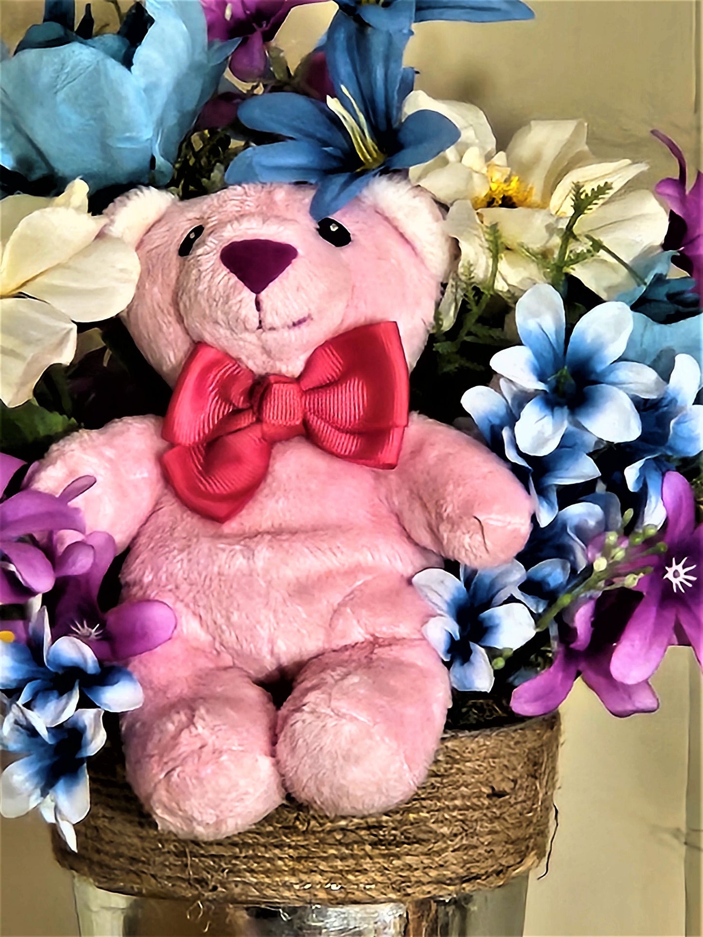 Artificial Flower Arrangement with Teddy Bear Sitting in a Bucket
