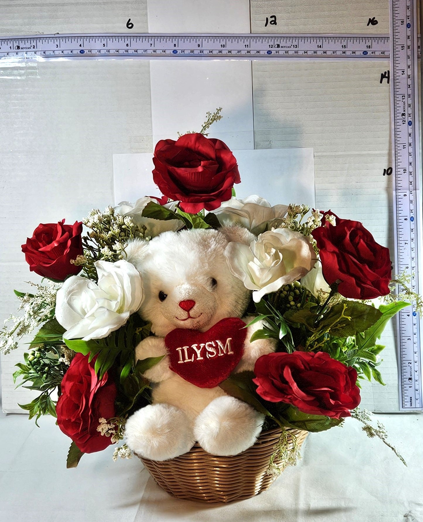 Adorable ILYSM Heart Bear Valentine Flower Arrangement - Red and White Roses and Baby's Breath in a Basket