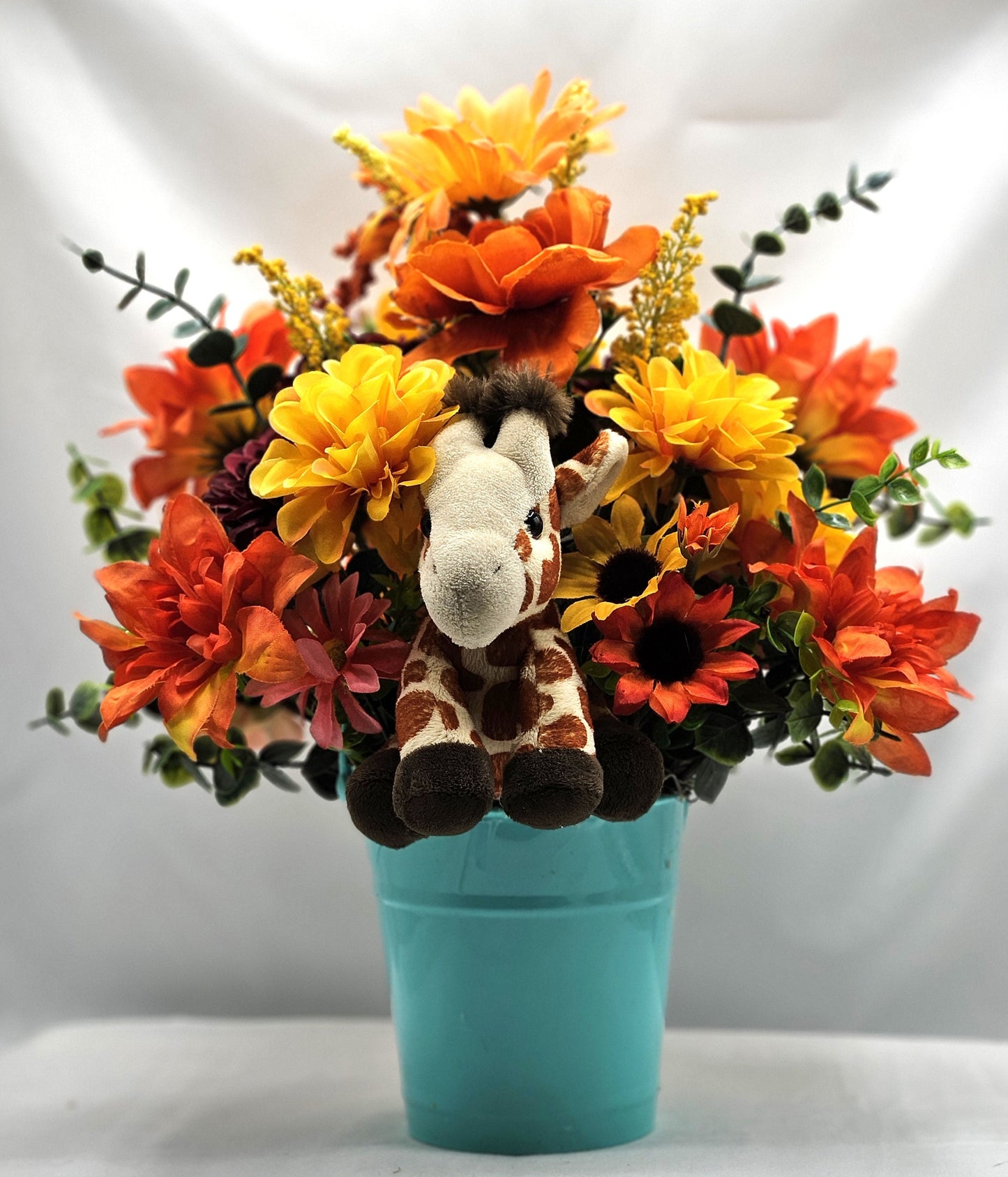 Artificial Flower Arrangement with Whimsical Little Giraffe Set in Aqua Blue Plastic Pail/Earthtone Floral Garden