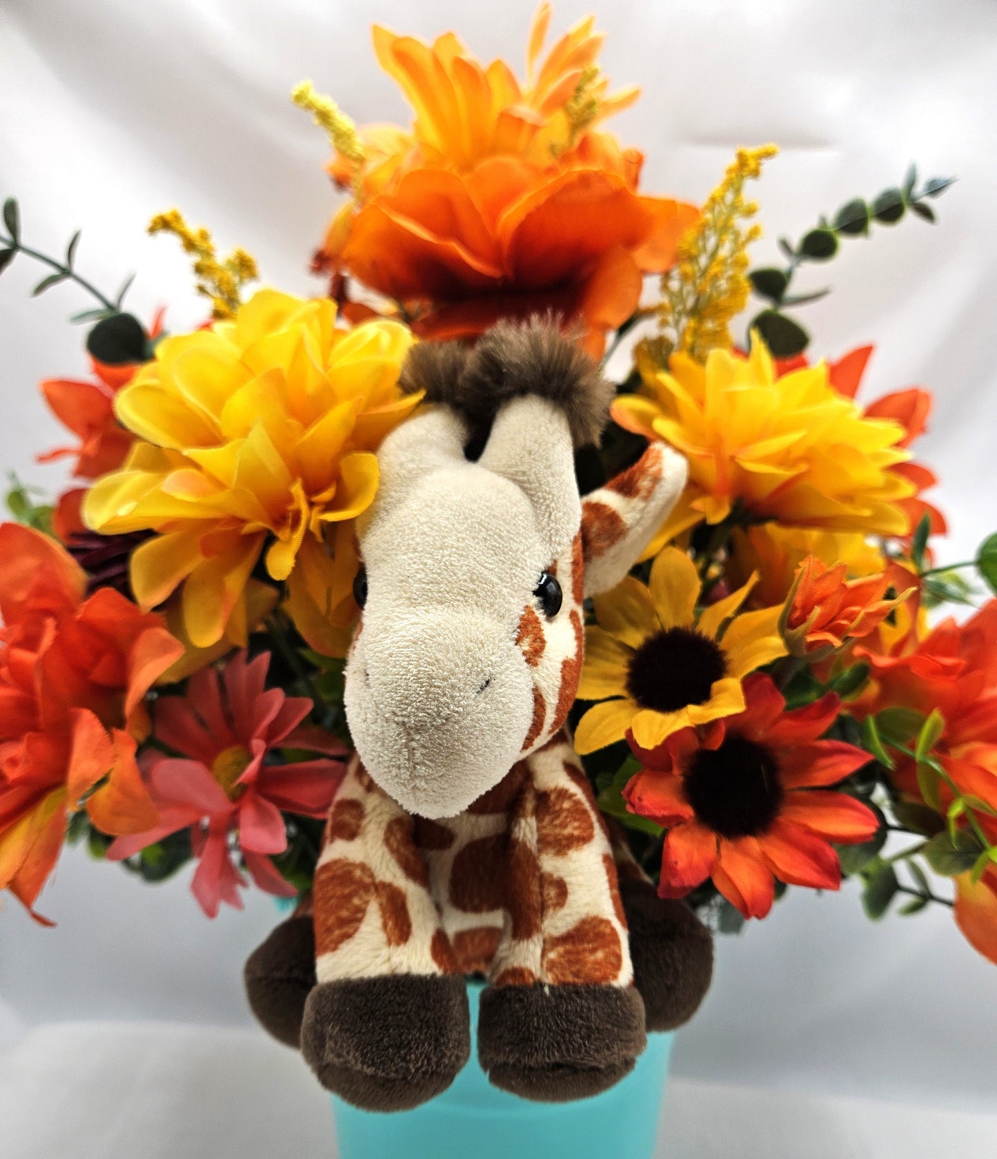 Artificial Flower Arrangement with Whimsical Little Giraffe Set in Aqua Blue Plastic Pail/Earthtone Floral Garden