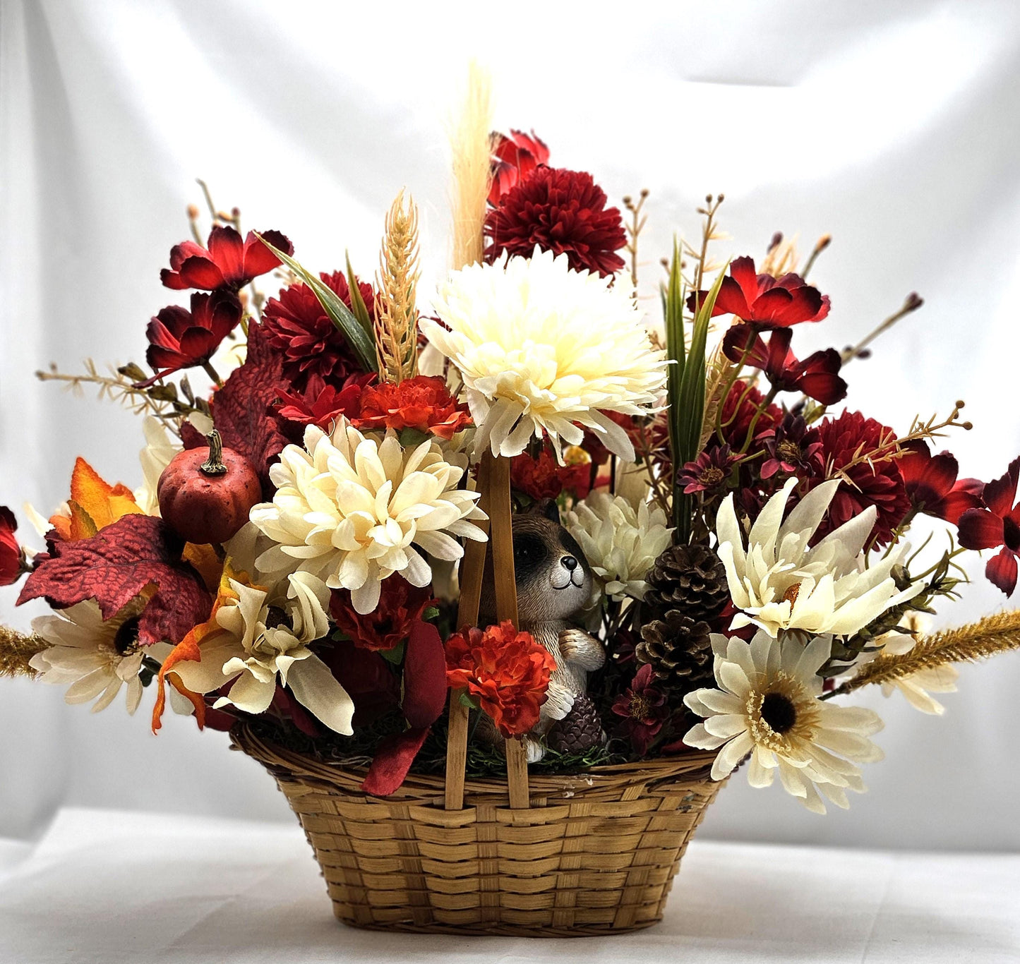 Deep Red and White Mums, Daisies, Other Wildflowers/Fall Leaves/Woodland Raccoon, Set in Handle Wicker Basket, Fall/Autumn Accents