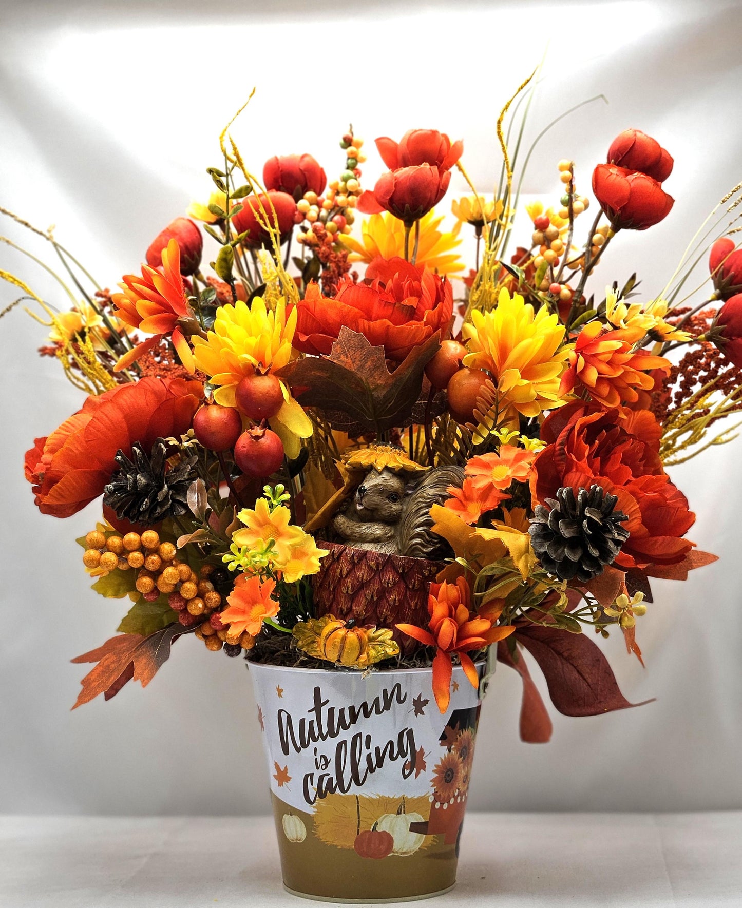 Autumn Is Calling Flower Arrangement/Cute Ceramic Squirrel Amidst Burnt Orange/Yellow Fall Flowers/Pine Cones/Berries/Wheat/Fall Grasses