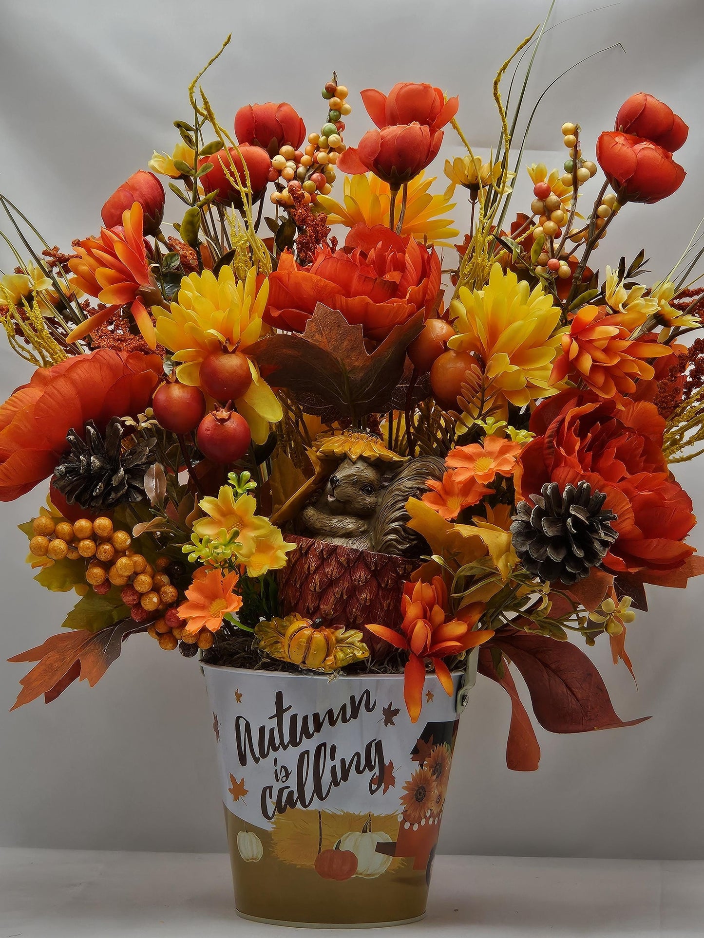 Autumn Is Calling Flower Arrangement/Cute Ceramic Squirrel Amidst Burnt Orange/Yellow Fall Flowers/Pine Cones/Berries/Wheat/Fall Grasses