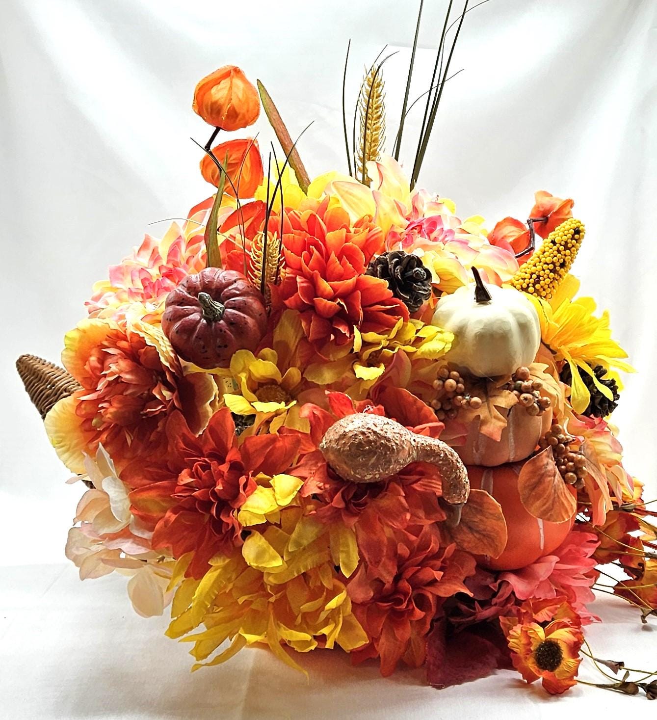 Elegant Thanksgiving Cornucopia with Orange and Yellow flowers, leaves, grasses, gourd and other Accents as Holiday Decor or Give as a Gift