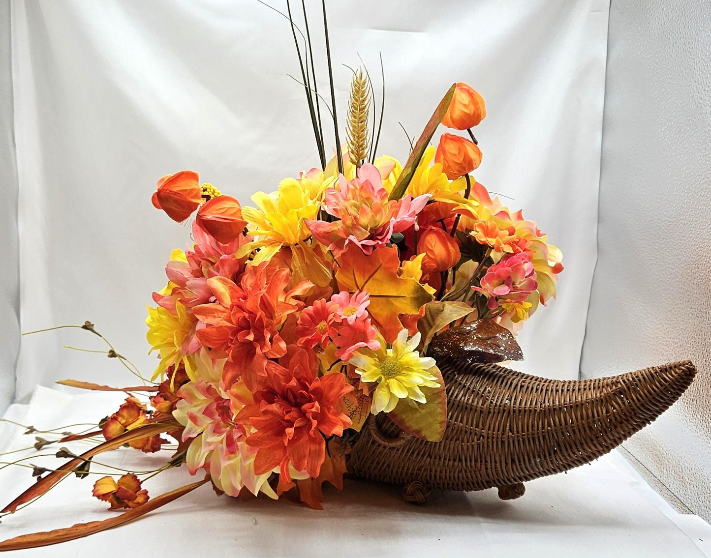 Elegant Thanksgiving Cornucopia with Orange and Yellow flowers, leaves, grasses, gourd and other Accents as Holiday Decor or Give as a Gift