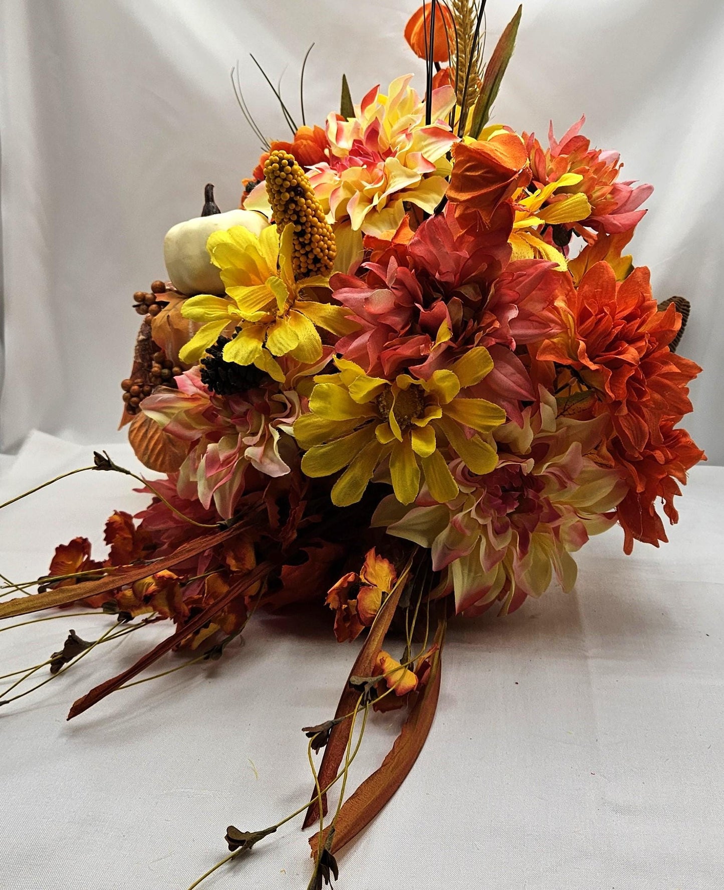 Elegant Thanksgiving Cornucopia with Orange and Yellow flowers, leaves, grasses, gourd and other Accents as Holiday Decor or Give as a Gift