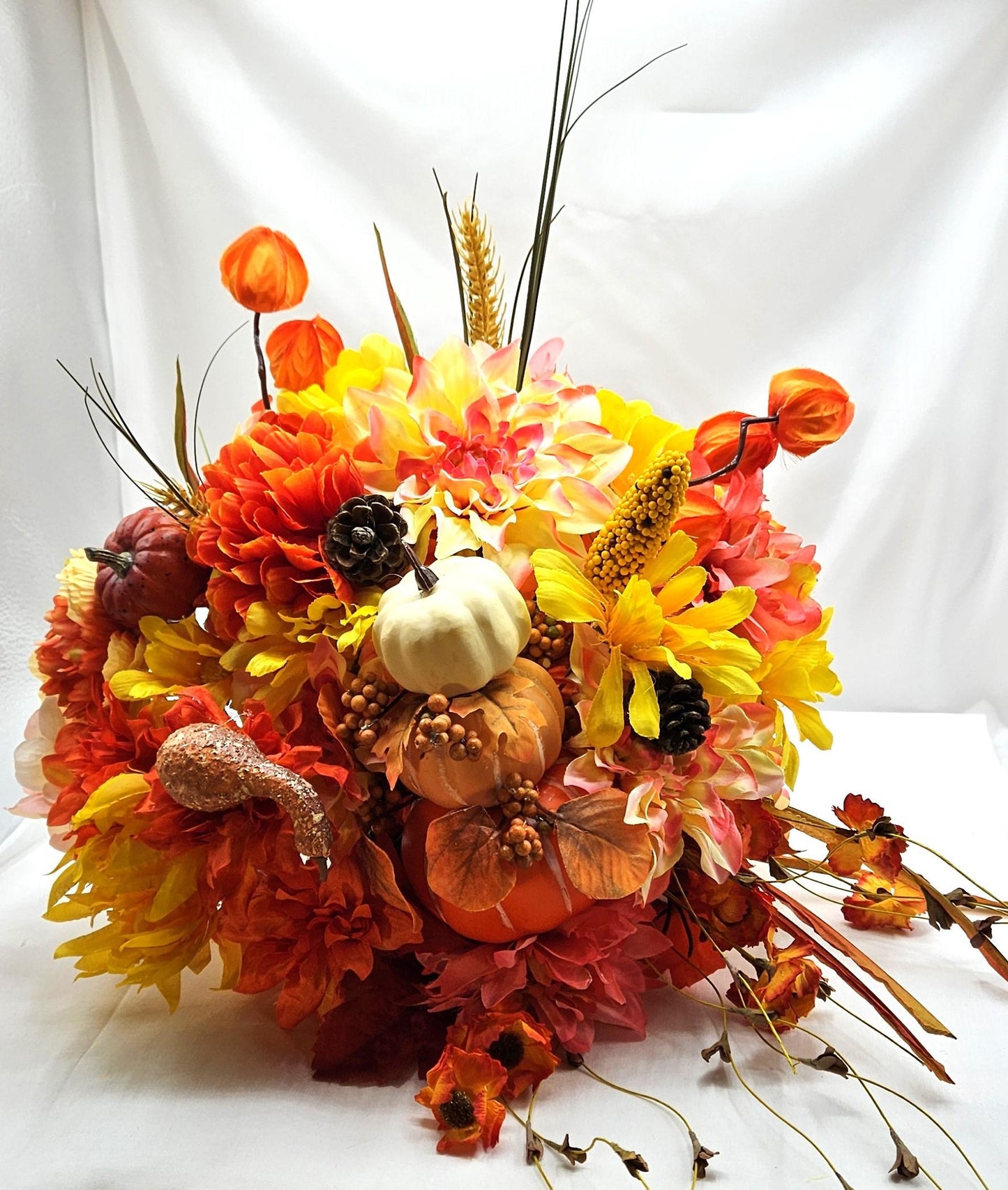 Elegant Thanksgiving Cornucopia with Orange and Yellow flowers, leaves, grasses, gourd and other Accents as Holiday Decor or Give as a Gift