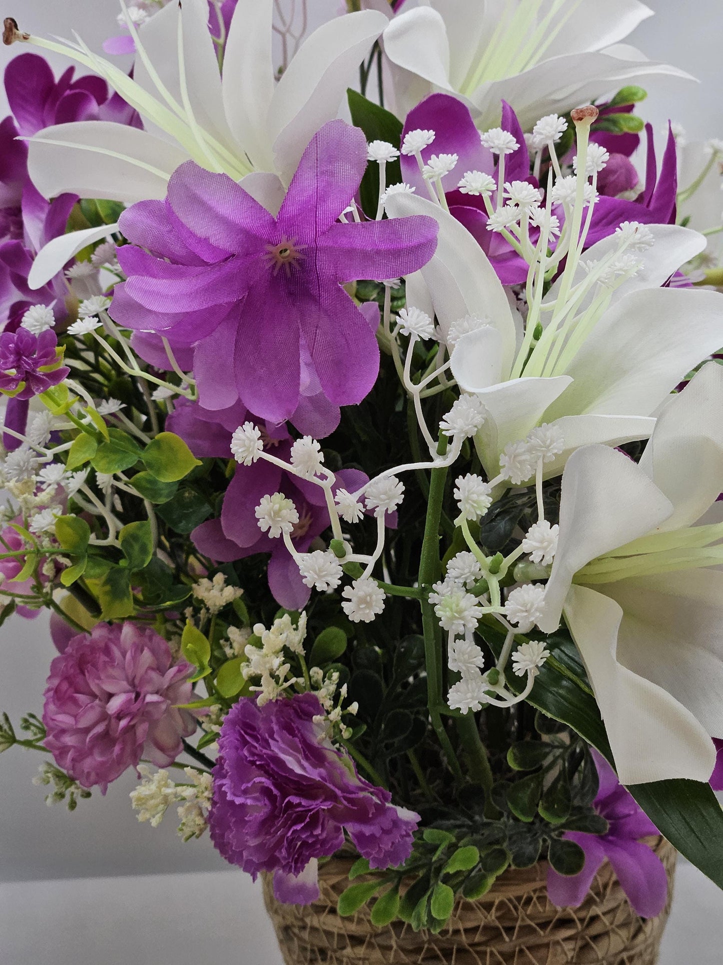 Amazing Grace Elegant Floral Arrangement Featuring a White Wooden Cross Nestled Amidst a Garden of White Lilies/Purple Orchids/wicker Basket