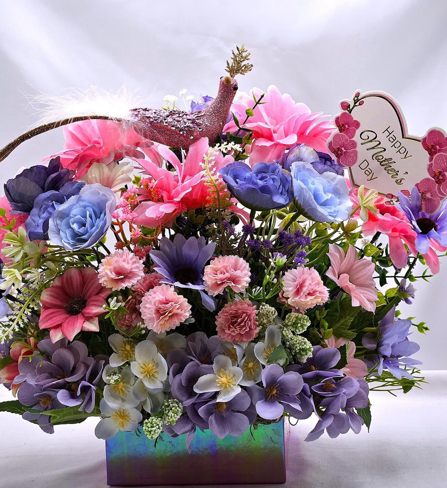 Pastel Pearlized Gift Box Filled with Vibrant/Lush Purple/Pink/White Flowers/Greenery/Baby's Breath/Sparkly Elegant Bird Atop the Florals