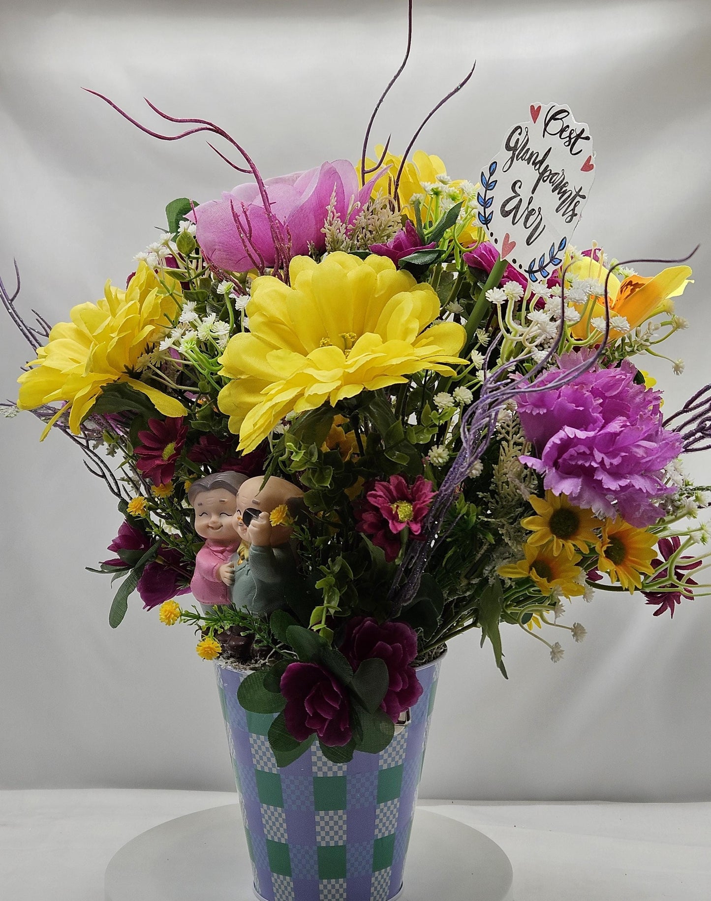For The Special Grandma and Grandpa/Floral Design in Simple Blue Pail/Grandparents Figures at the Front of Colorful Yellow/Pink Flowers Plus