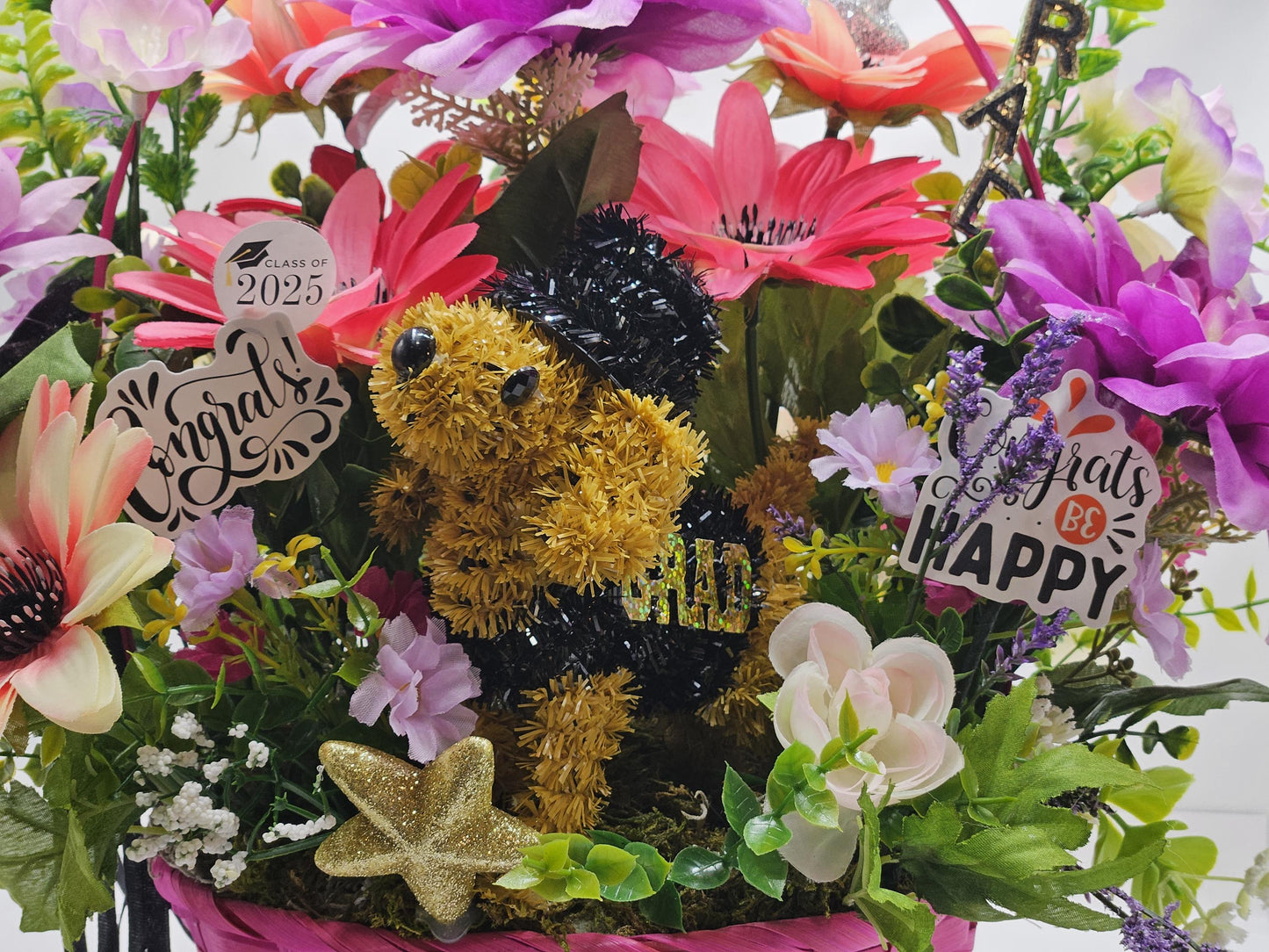 Whimsical Graduation Flower Arrangement in Pink Wicker Basket, Congrats and Enjoy Every Moment Signs with Pink/Purple Florals/Greenery