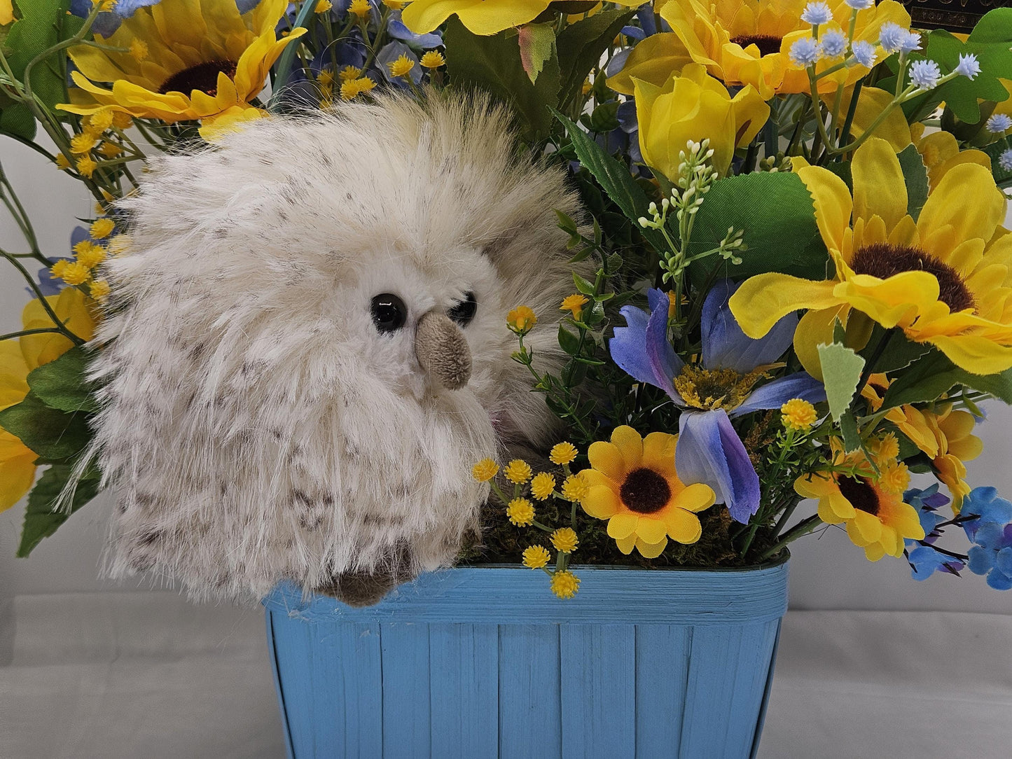 Elegant Silk-type Graduation Florals/Greenery with Unique Fuzzy Owl/Hedgehog/Platypus Accents/Wood Baskets/Blues/Yellow/Green Flowers