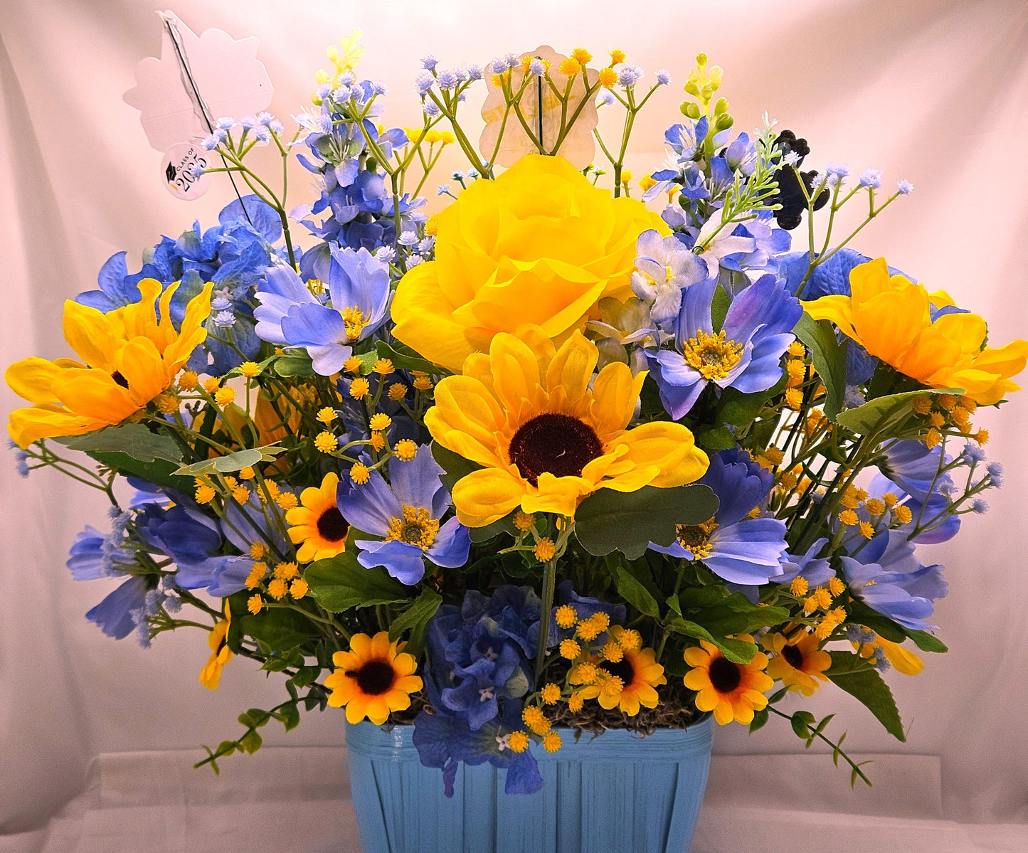 Elegant Silk-type Graduation Florals/Greenery with Unique Fuzzy Owl/Hedgehog/Platypus Accents/Wood Baskets/Blues/Yellow/Green Flowers