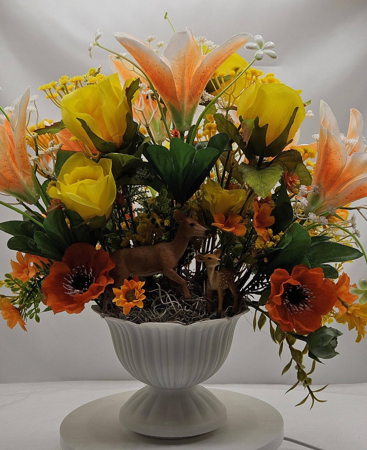 Momma and baby deer frolicking in a floral garden of yellow and orange Lilies, Pansies, Roses/other Florals, Greenery/Baby's Breath/Gifting