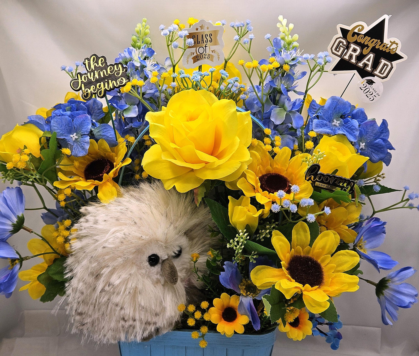 Elegant Silk-type Graduation Florals/Greenery with Unique Fuzzy Owl/Hedgehog/Platypus Accents/Wood Baskets/Blues/Yellow/Green Flowers