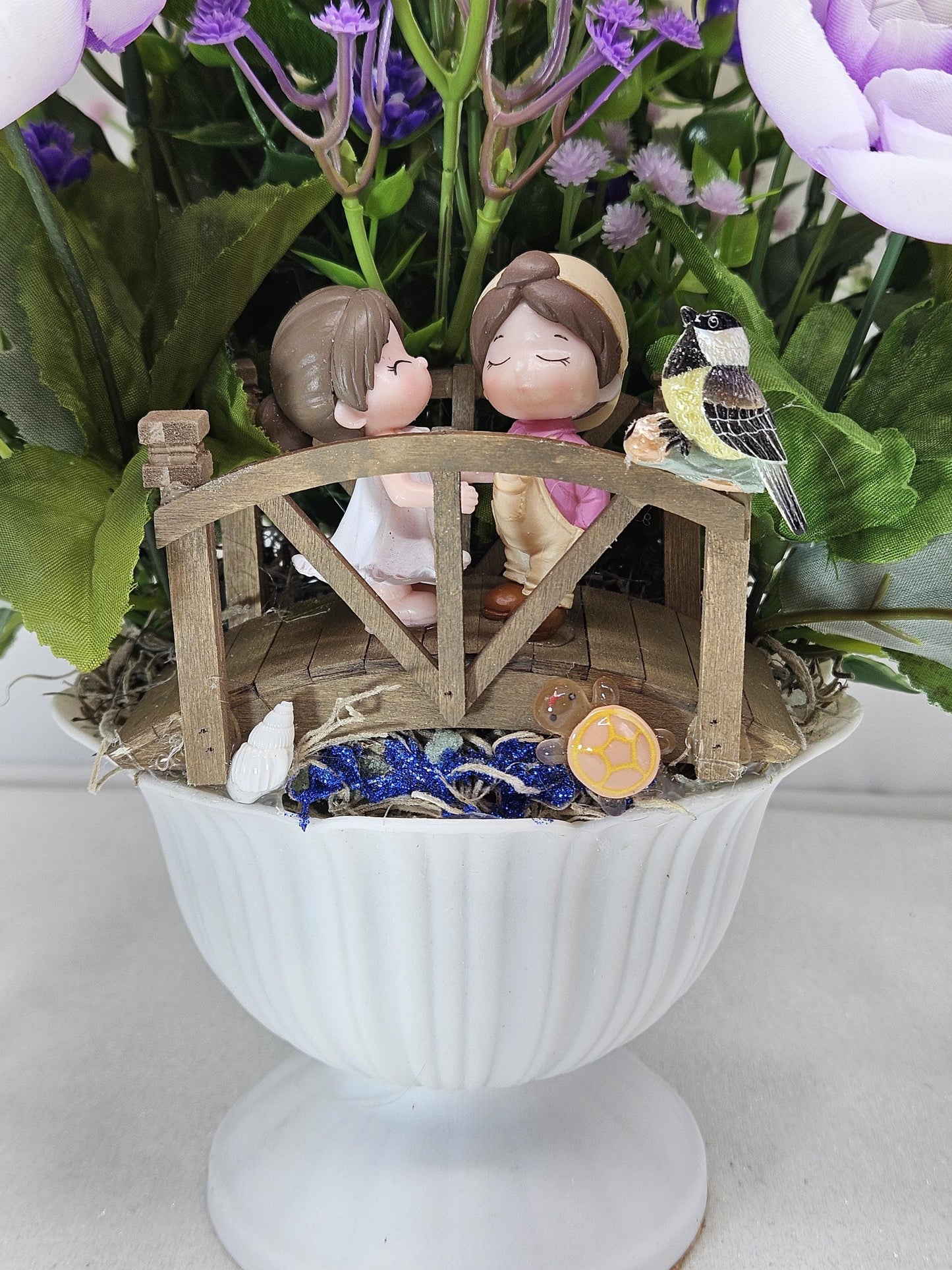 Cute Couple on a Bridge Amidst Garden of Lavender/Purple/White Flowers/Greenery/Babys Breath/Bird and Turtle on the Bridge