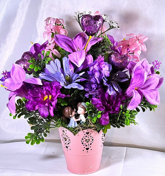 Heartwarming Flower Arrangement with a Kissing Couple Among Blue, Lilac, and Pink Florals Plus Sparkly Hearts