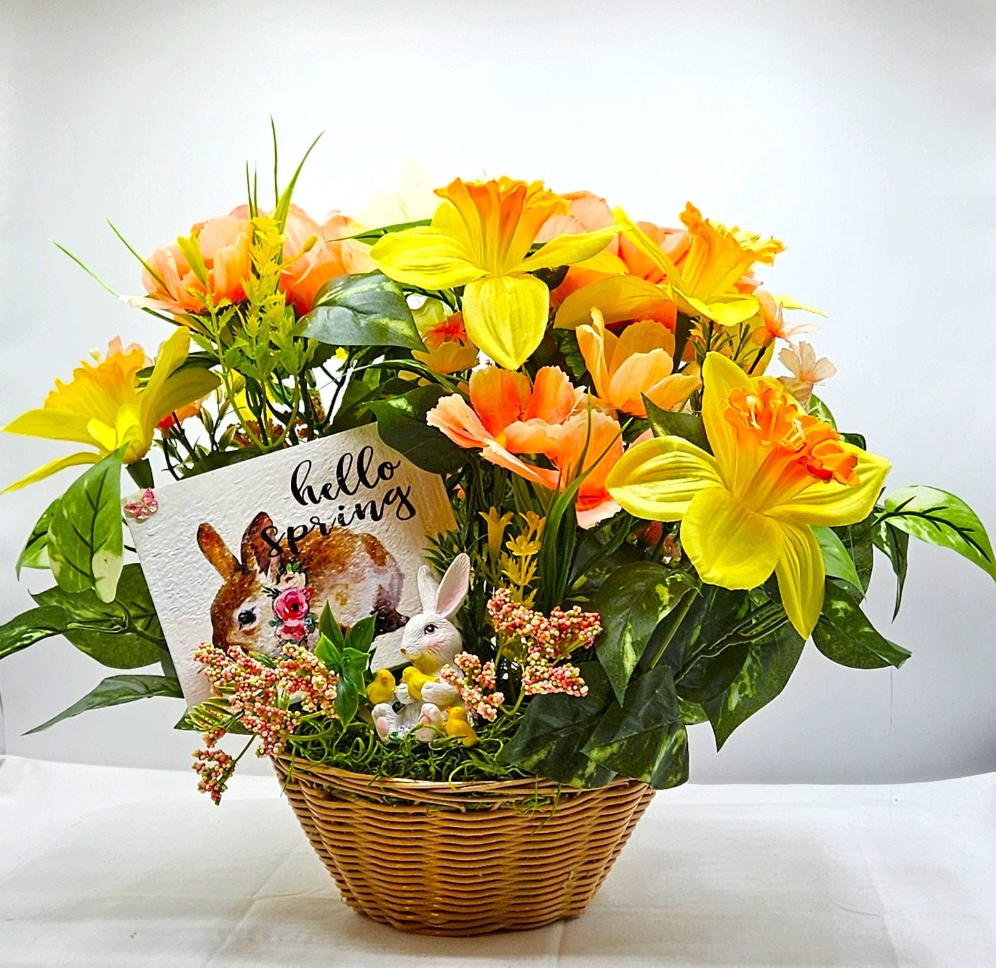 Hello Spring Flower Arrangement Featuring Cute Bunnies Amidst Daffodils, Cosmos, Peonies and Other Spring Flowers and Greenery