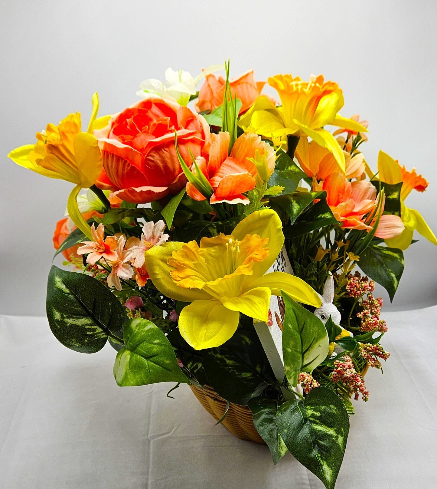 Hello Spring Flower Arrangement Featuring Cute Bunnies Amidst Daffodils, Cosmos, Peonies and Other Spring Flowers and Greenery