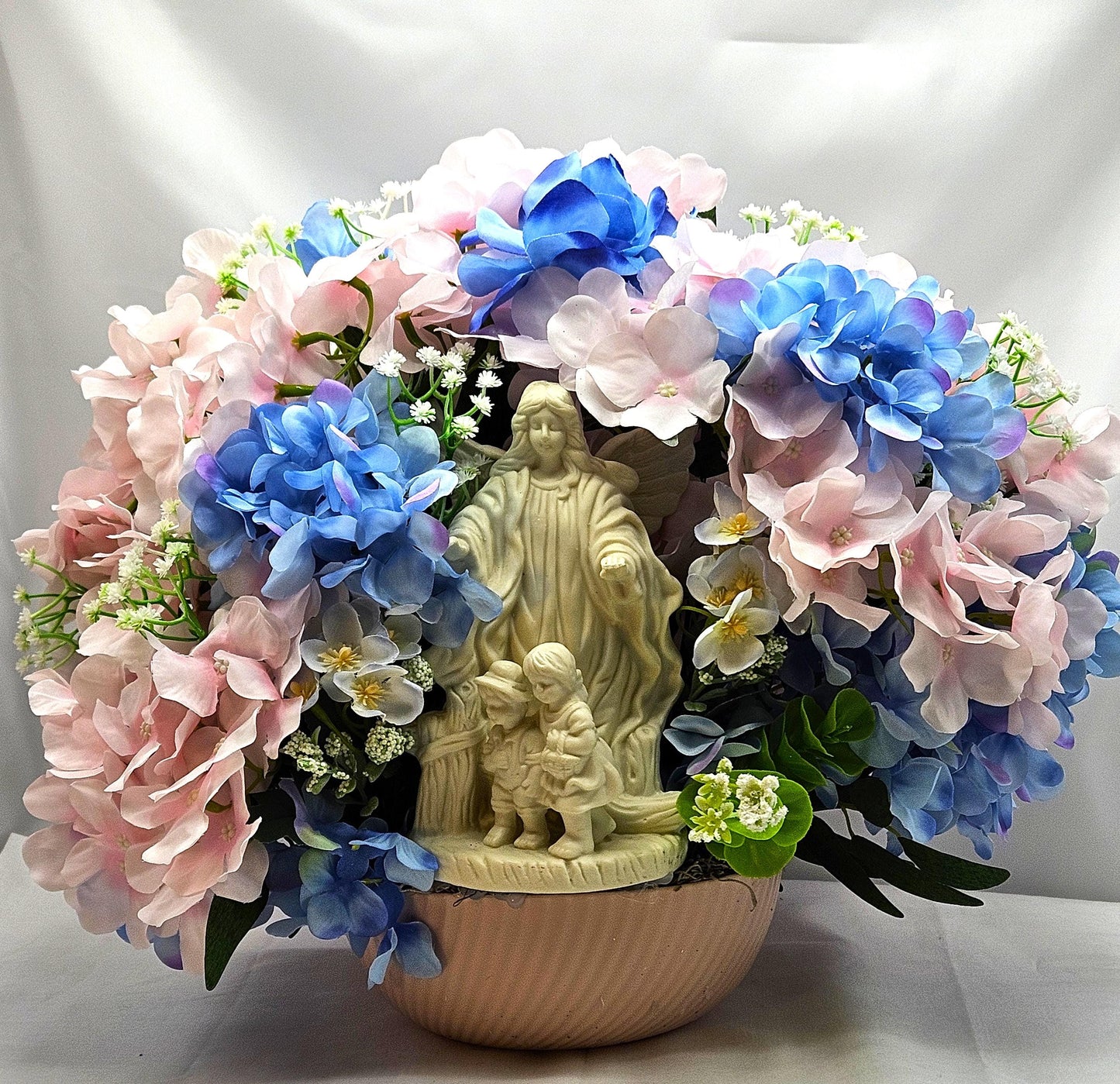 Floral Centerpiece/Guardian Angel With Little Children Amidst A Garden Of Pink And Blue Hydrangea Flowers/Greens/Baby's Breath/Lovely