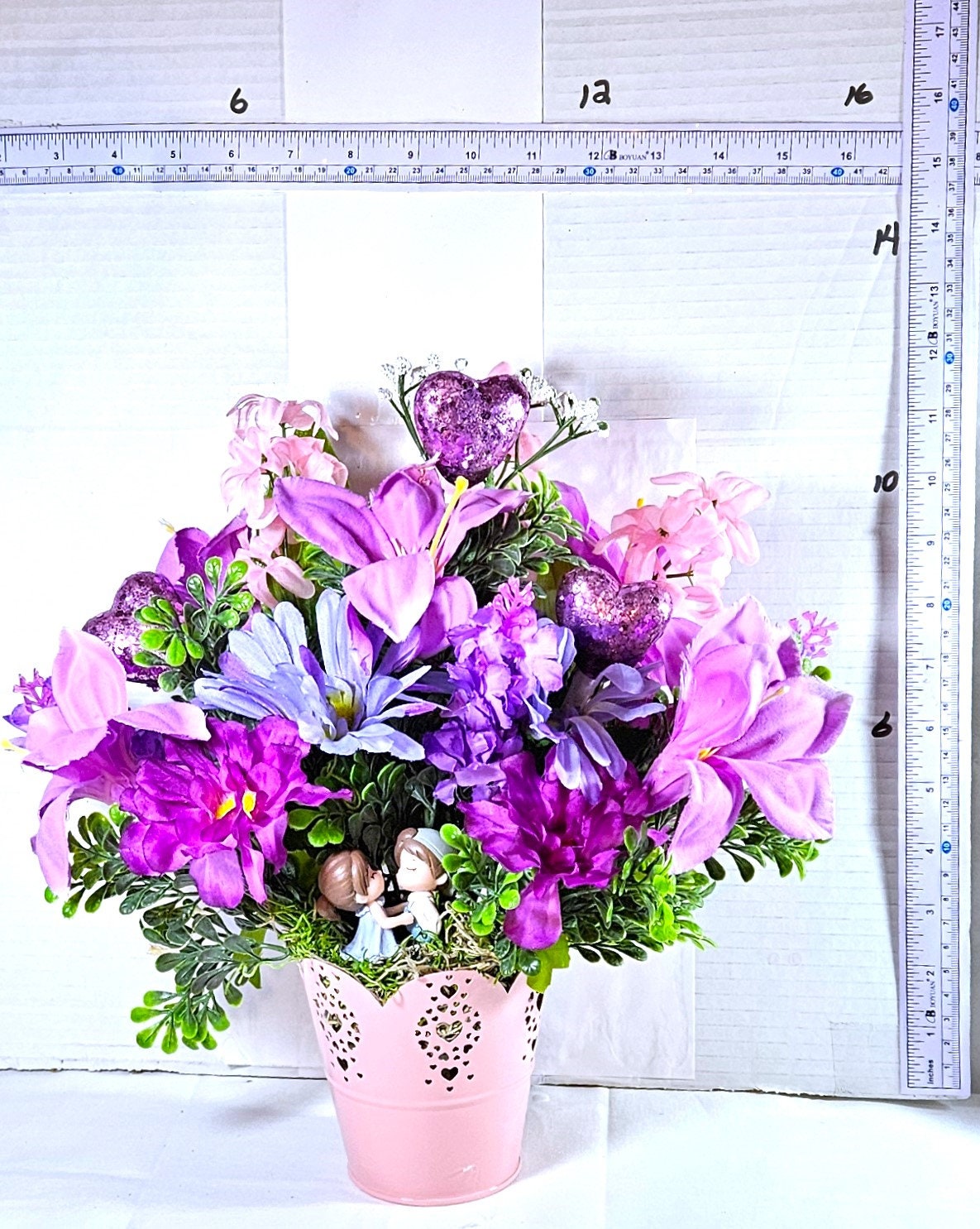 Heartwarming Flower Arrangement with a Kissing Couple Among Blue, Lilac, and Pink Florals Plus Sparkly Hearts
