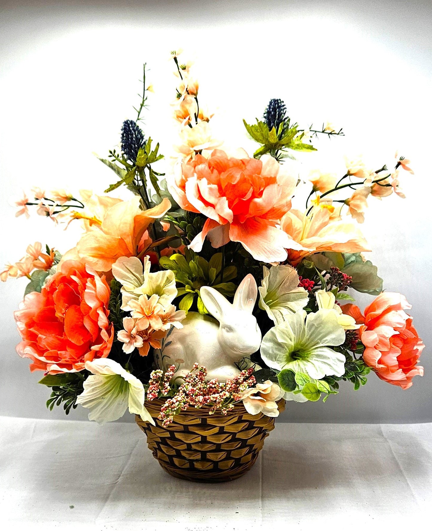 Elegant Spring Centerpiece with Bunny in Wicker Basket,  Peach and Jade Colored Peonies, Petunias and other Spring Flowers