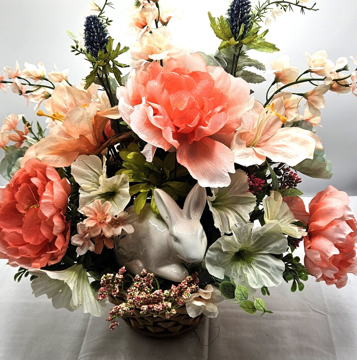 Elegant Spring Centerpiece with Bunny in Wicker Basket,  Peach and Jade Colored Peonies, Petunias and other Spring Flowers