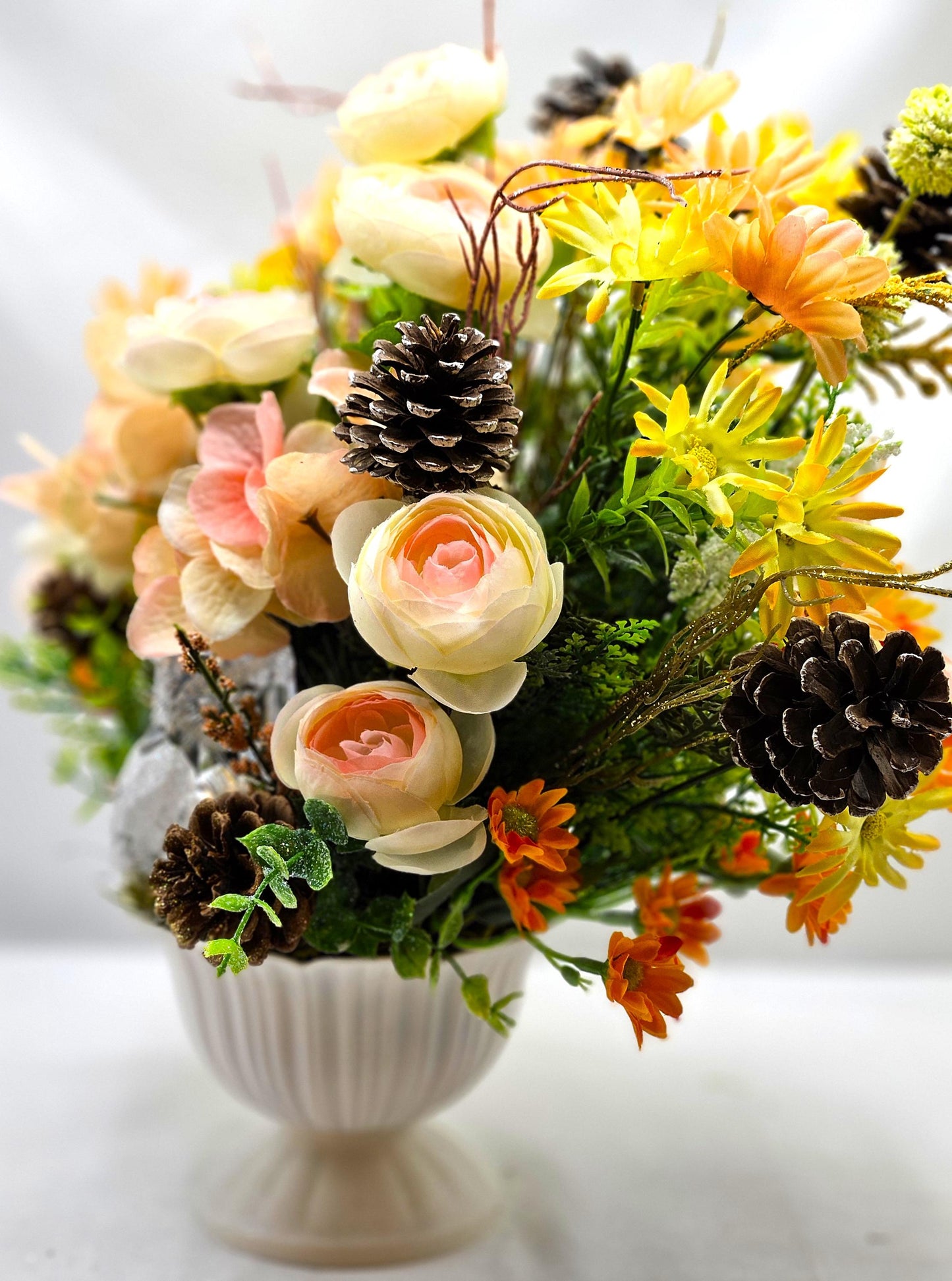 Striking Floral Centerpiece Featuring a Stunning Crystal-Look Majestic Owl Amidst a Garden of Multi-Colored WildflowersGreenery/PineCones