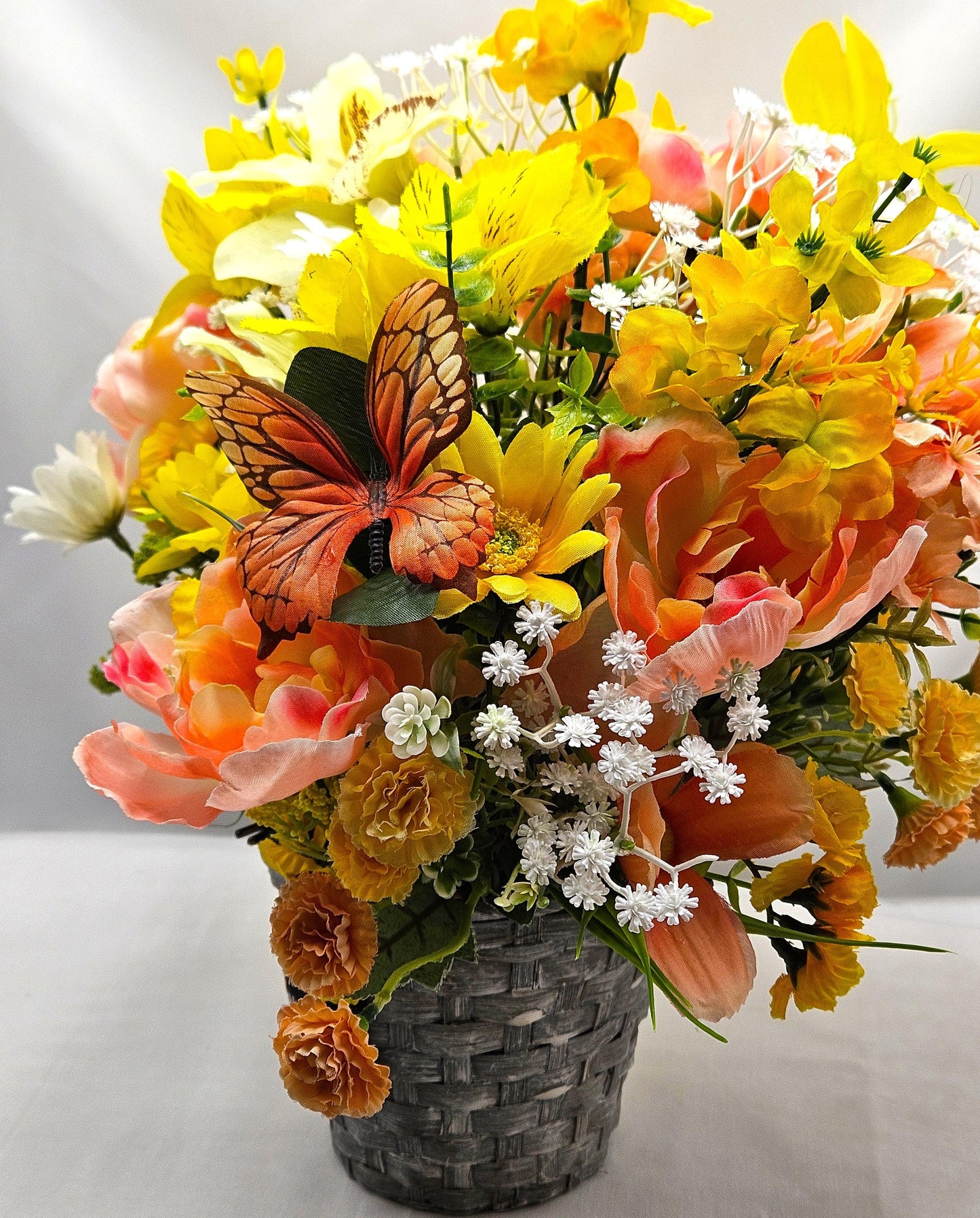 Mother's Day Bouquet in Wicker Type Pot/Love on Mother's Day/Featuring a Cheerful Bird in a Garden of Vibrant Yellow/Peach Flowers/Butterfly