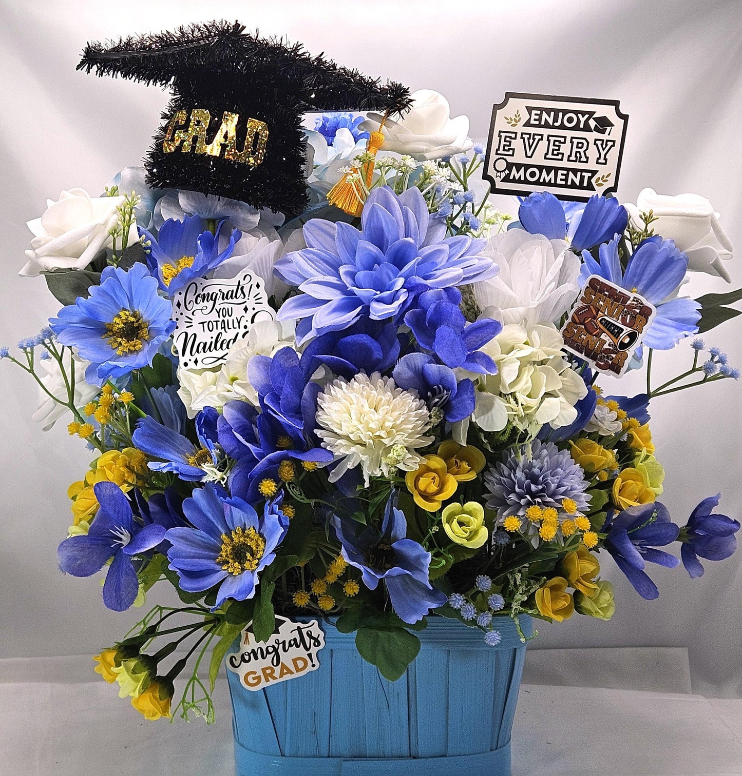 Graduation Floral Centerpiece/Blue Wood Basket/Blue/White/Yellow Flowers/Graduation Hat/Congratulations Messages/Roses/Dahlias/Pansies Plus
