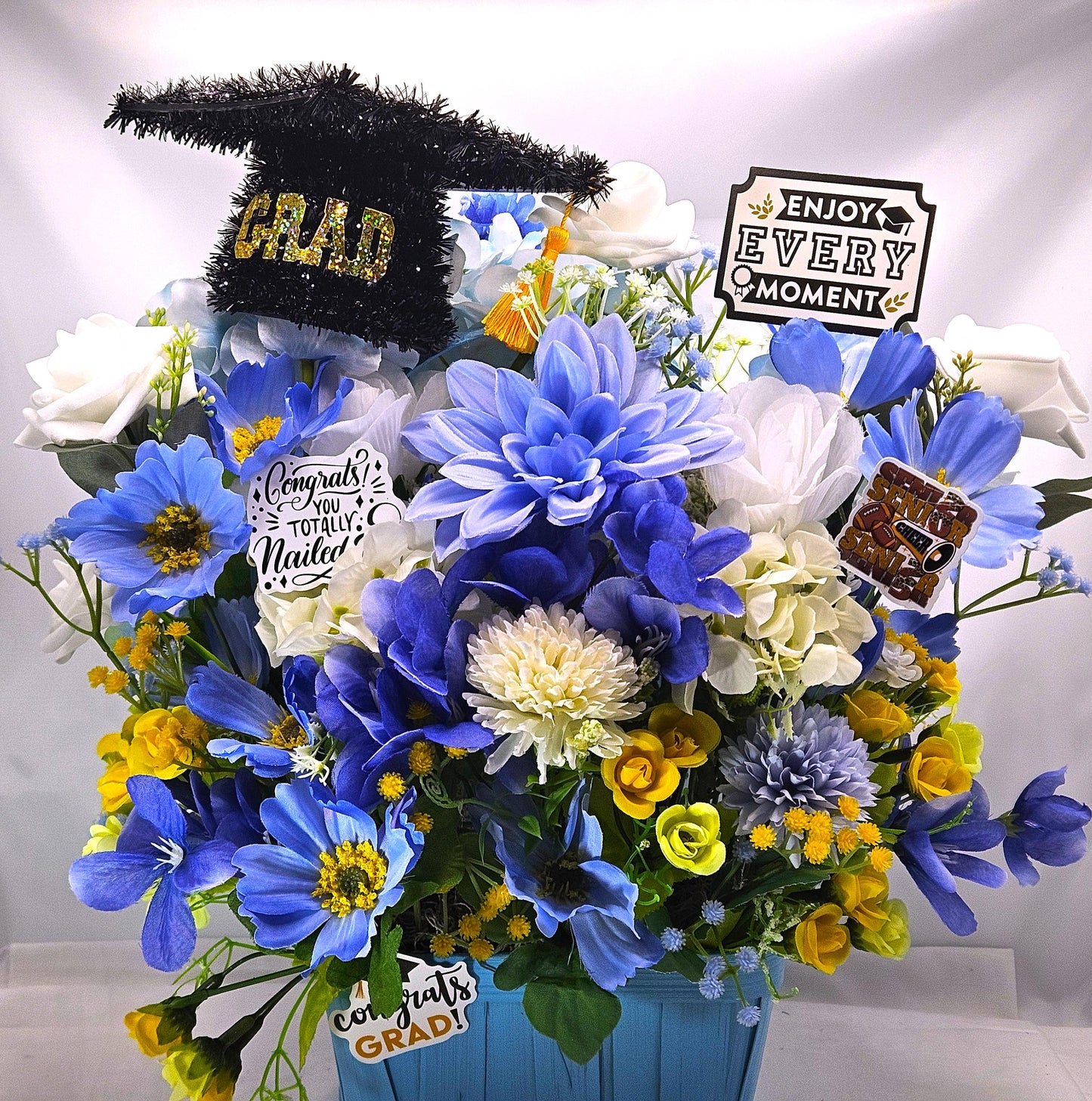Graduation Floral Centerpiece/Blue Wood Basket/Blue/White/Yellow Flowers/Graduation Hat/Congratulations Messages/Roses/Dahlias/Pansies Plus