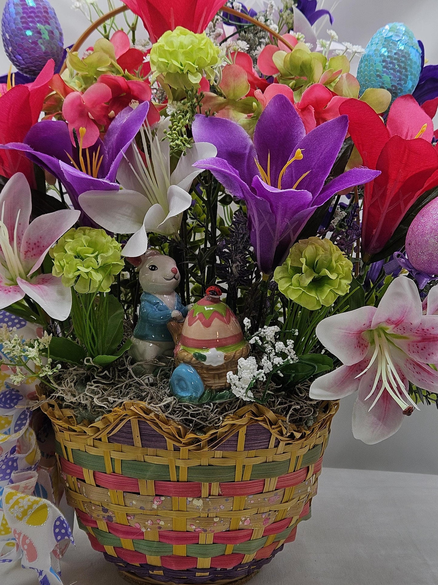Exquisite Multi-Colored Scalloped Easter Basket w/Lovely Glittery Bow/A Variety of Lilies in Basket/Rabbit Pushing Cart/Other Easter Accents