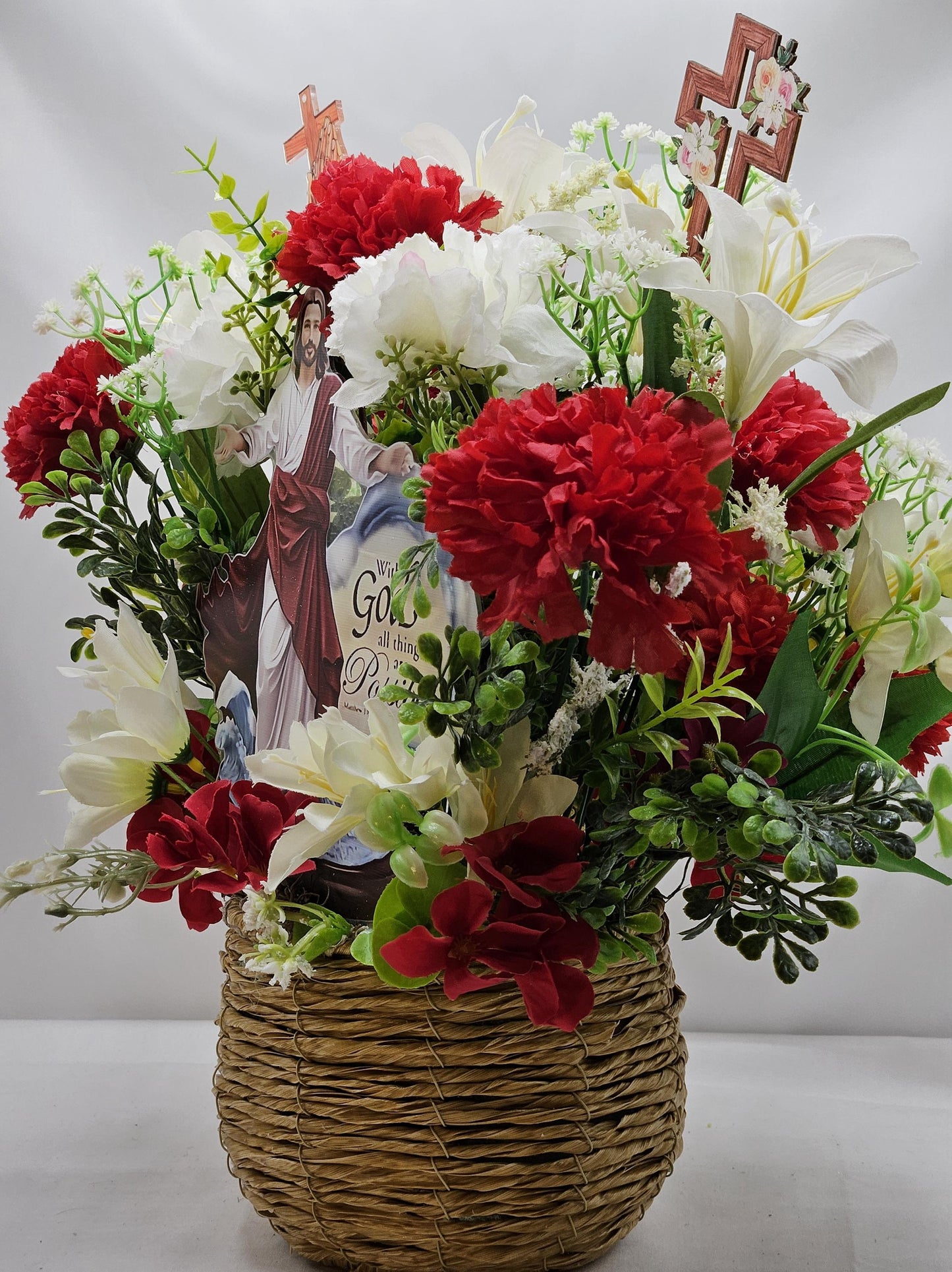 With God All Things Are Possible Flower Centerpiece Featuring Jesus Rising Within A Floral Garden of Lilies/Carnations/Added Cross Signs