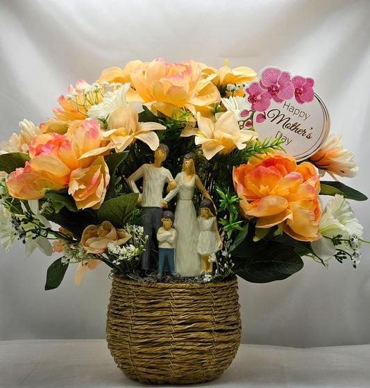Family of Four Ceramic Figures Amidst Peach/White Flowers in Elegant Round Wicker Basket, Baby's Breath/Greenery/Mother's Day Sign
