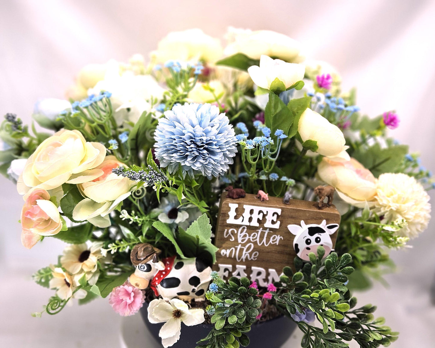 Life is Better on the Farm Floral Centerpiece w/Country Cow, Curious Sign and Various Farm Farm Animals Amidst Ranunculus/Other Flowers